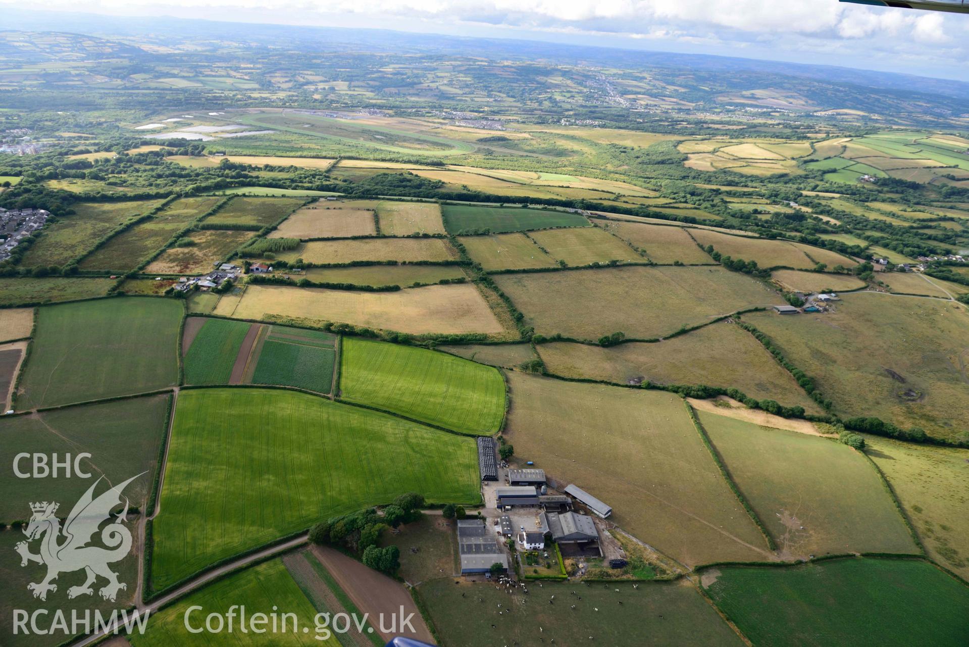 RCAHMW colour oblique aerial photograph of Parc Willis, cropmark of defended enclosure taken on 17 July 2018 by Toby Driver (NGR: SN470037)