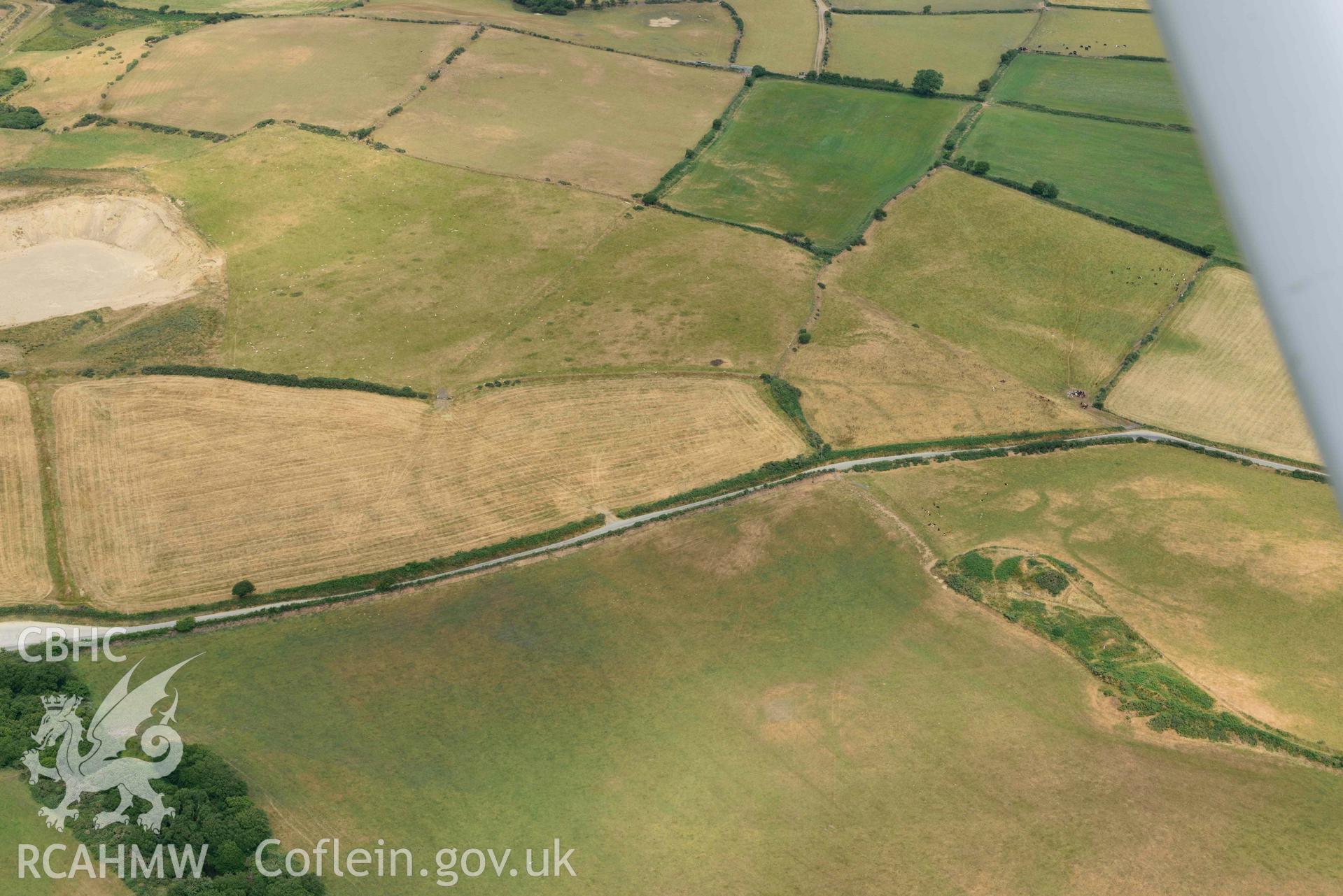 RCAHMW colour oblique aerial photograph of Crugiau Cemmaes Barrow Cemetary + Crugiau Cemmaes Banjo enclosure taken on 11 July 2018 by Toby Driver