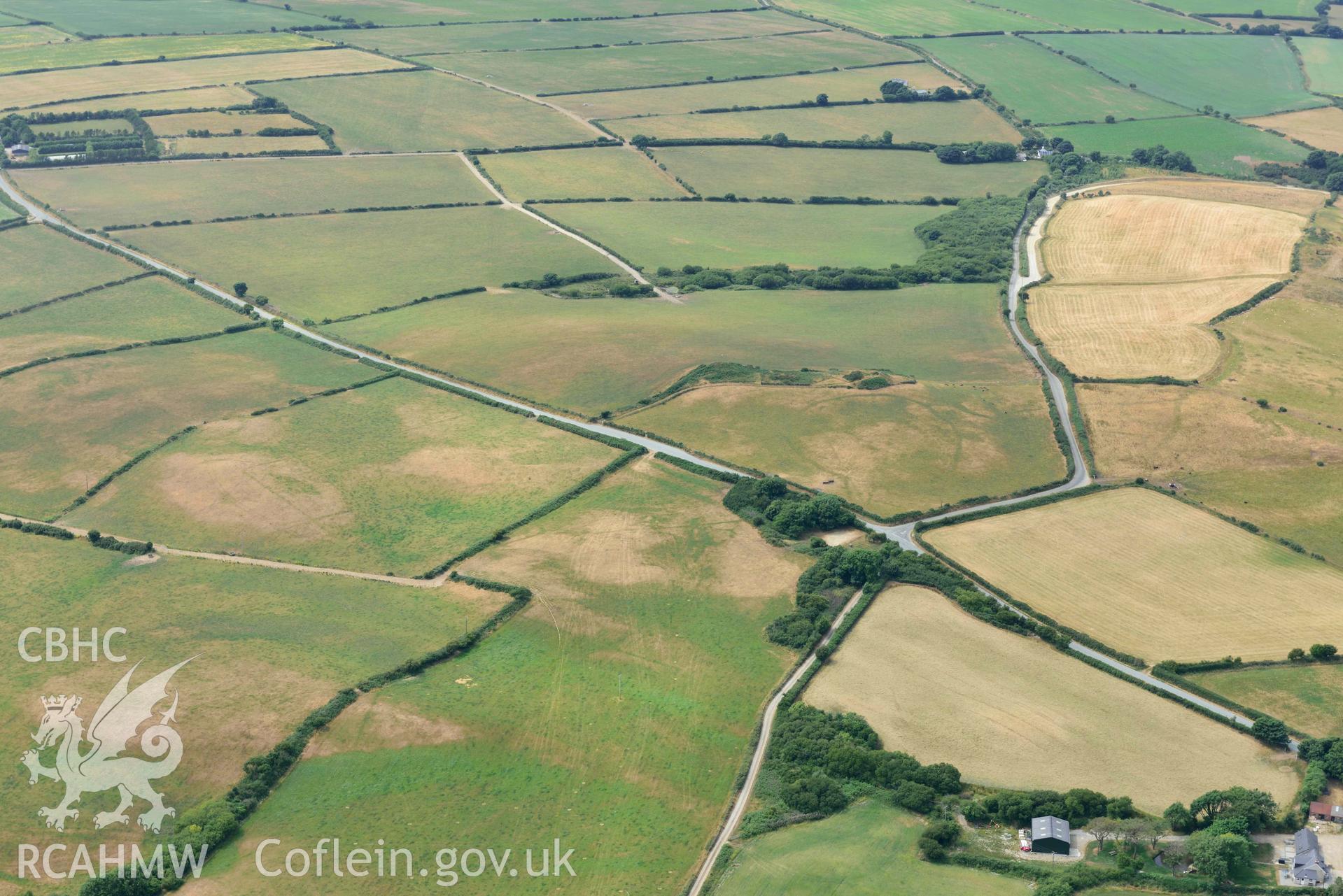 RCAHMW colour oblique aerial photograph of Crugiau Cemmaes Barrow Cemetary taken on 11 July 2018 by Toby Driver