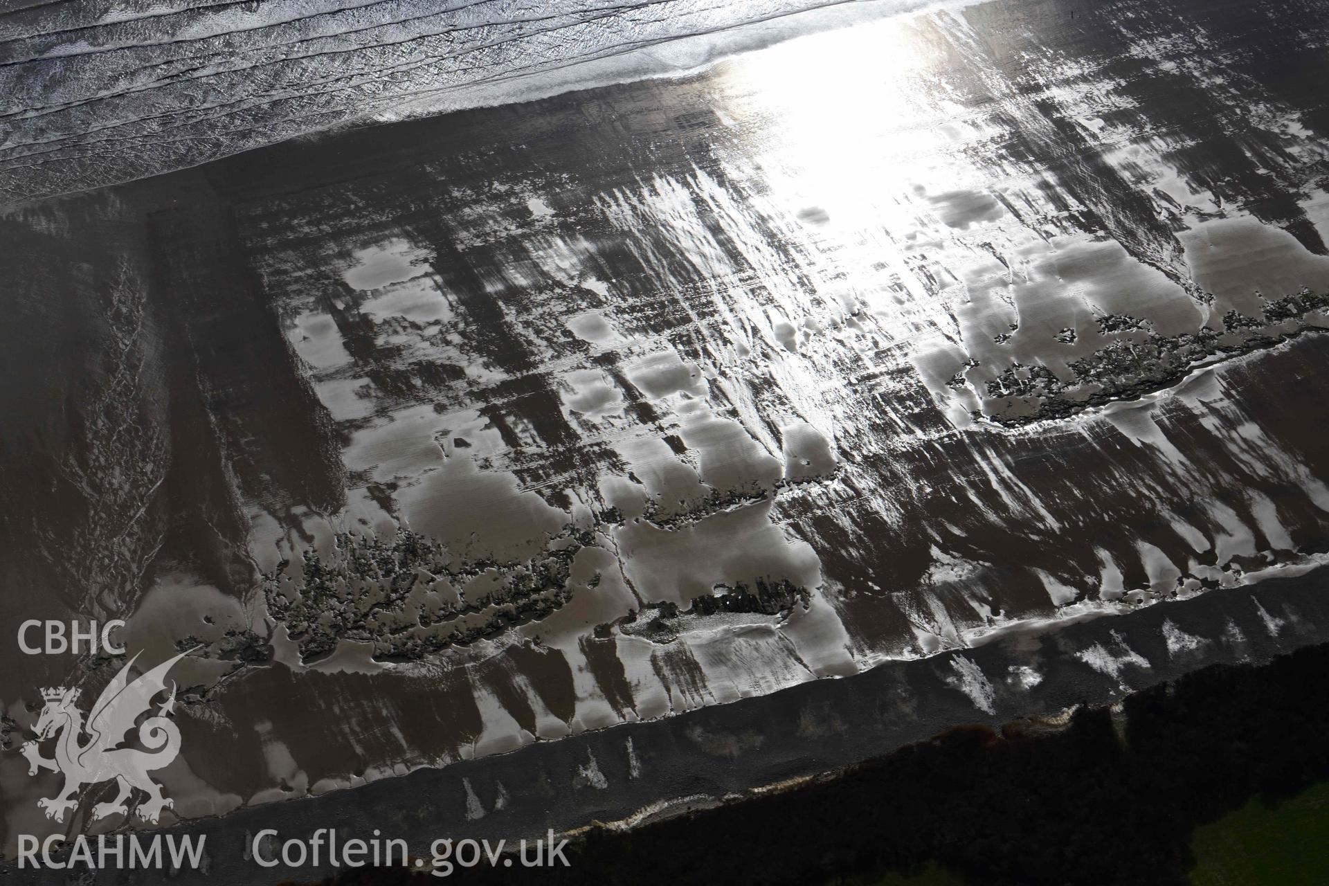 RCAHMW colour oblique aerial photograph of Marros Sands, peat deposits, south of Underhill taken on 4 March 2022 by Toby Driver ((SN202074)