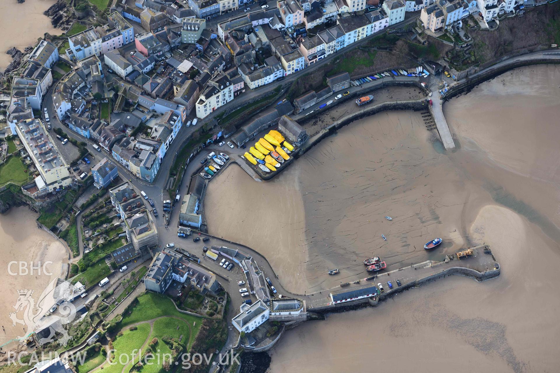 RCAHMW colour oblique aerial photograph of Tenby harbour at low tide taken on 4 March 2022 by Toby Driver ((SN135005)