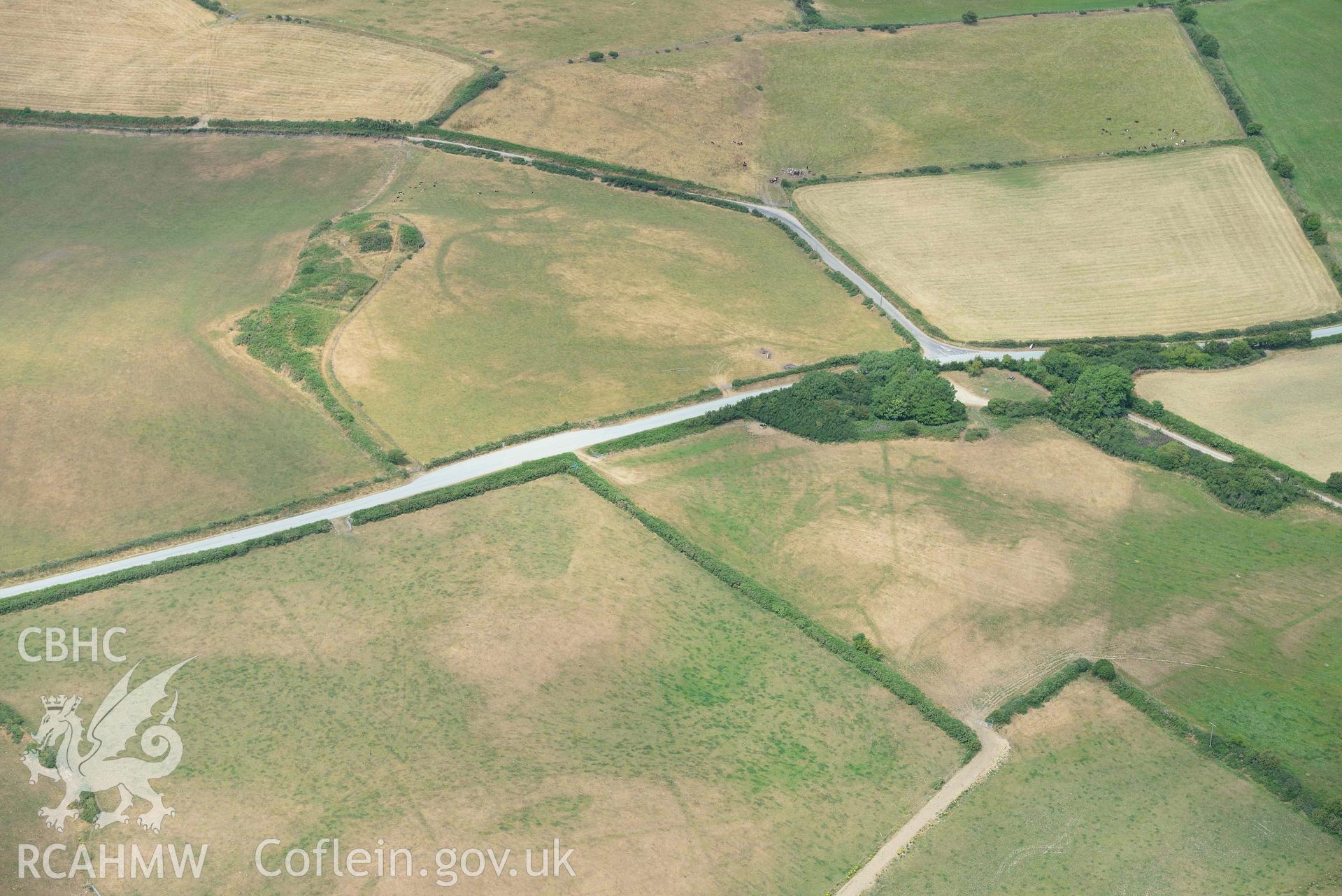 RCAHMW colour oblique aerial photograph of Crugiau Cemmaes Barrow Cemetary taken on 11 July 2018 by Toby Driver