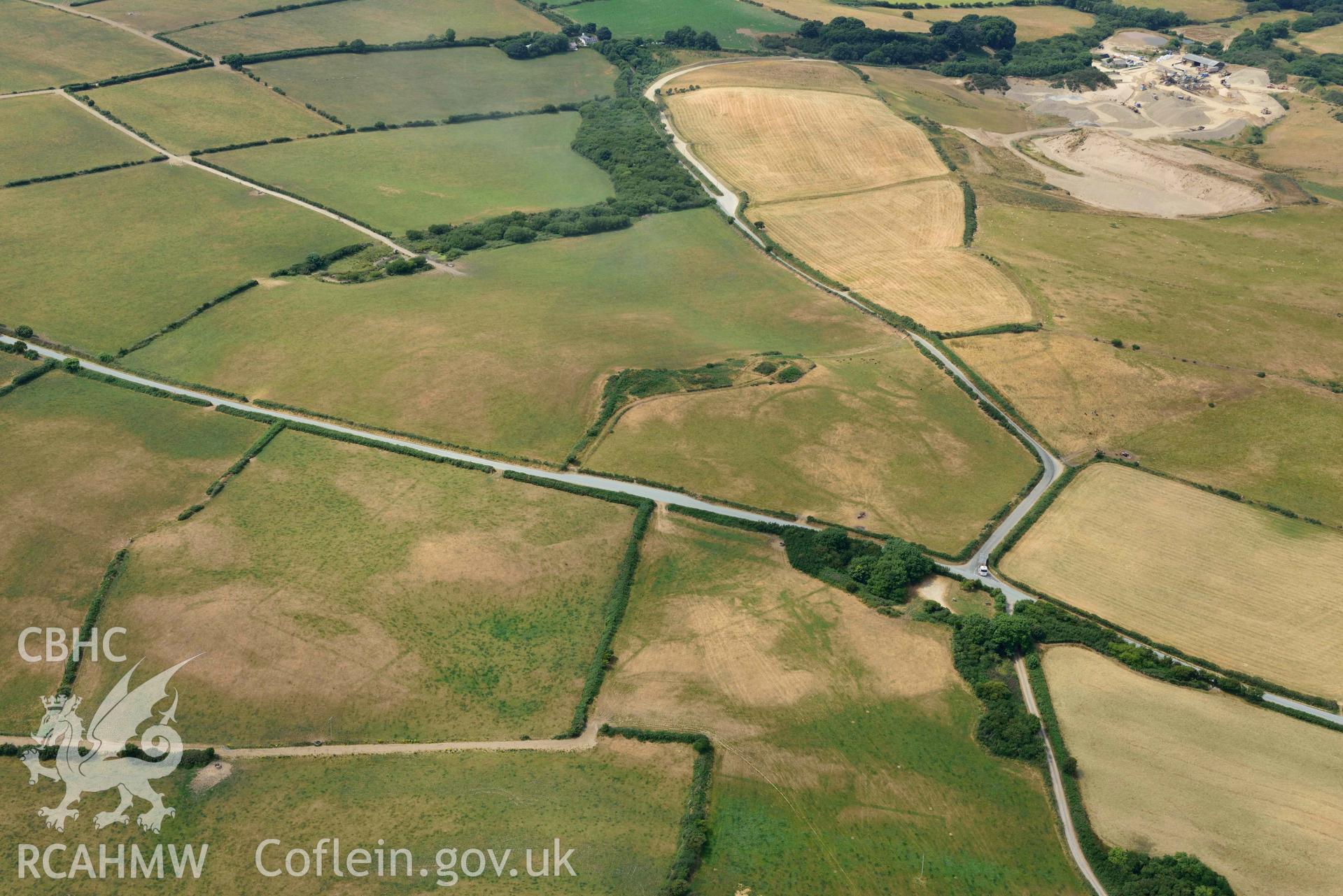 RCAHMW colour oblique aerial photograph of Crugiau Cemmaes Barrow Cemetary, Crugiau Cemmaes Banjo enclosure, Crugiau Cemmaes Southeast (Rectangular Enclosure) taken on 11 July 2018 by Toby Driver