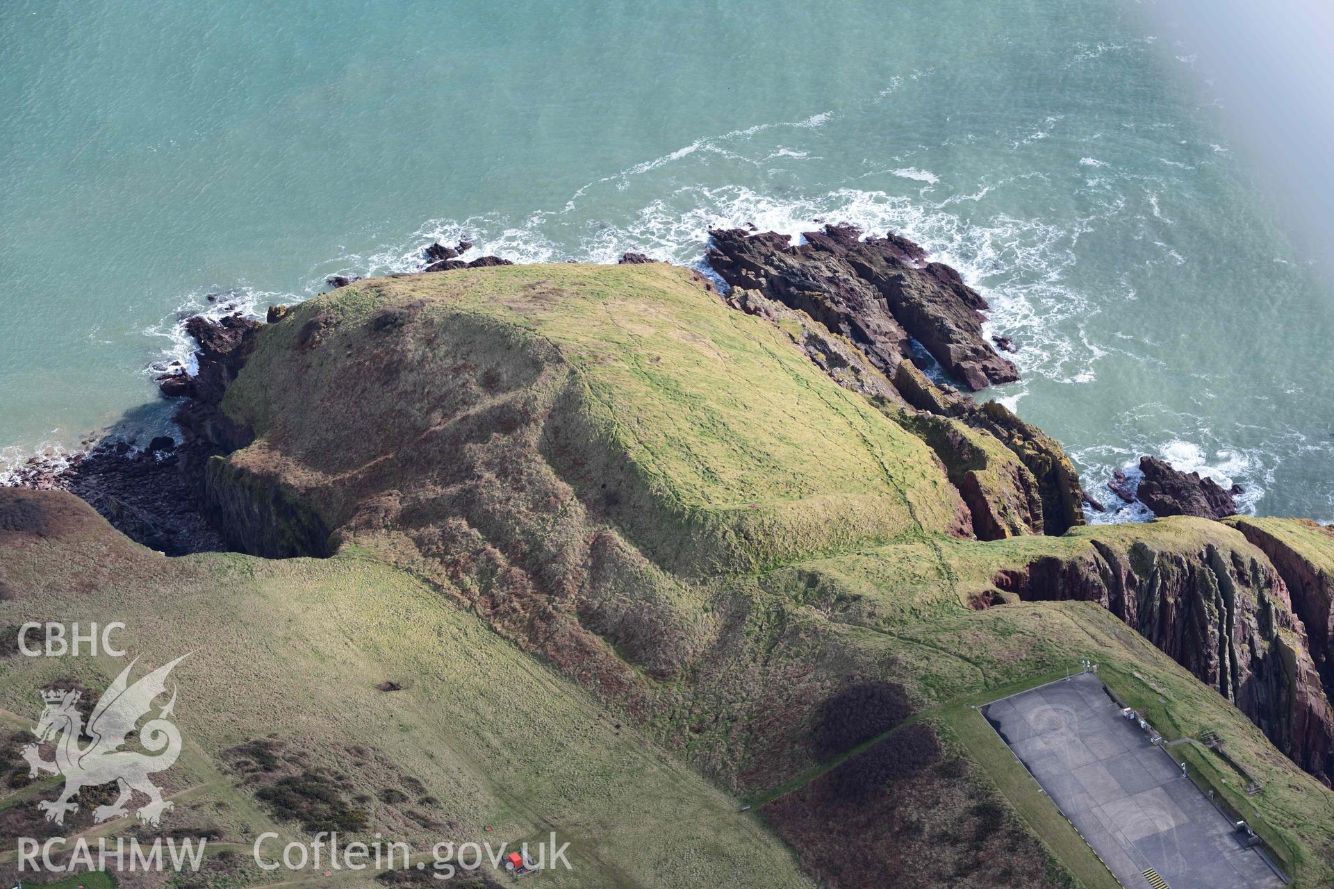 RCAHMW colour oblique aerial photograph of Old Castle Head promontory fort taken on 4 March 2022 by Toby Driver ((SS075966)