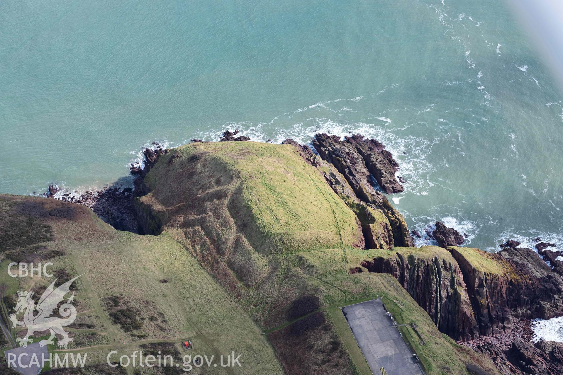 RCAHMW colour oblique aerial photograph of Old Castle Head promontory fort taken on 4 March 2022 by Toby Driver ((SS075966)