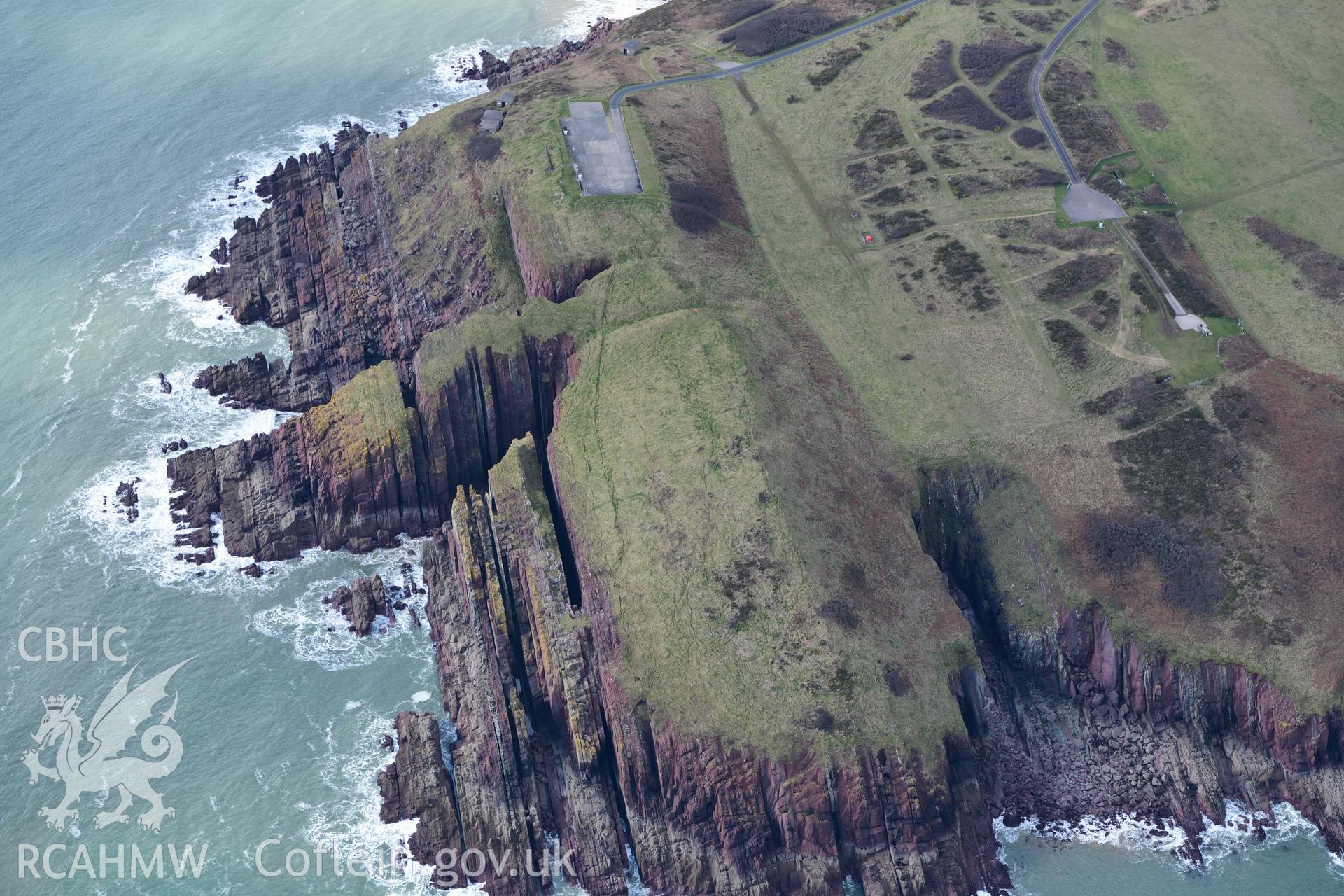 RCAHMW colour oblique aerial photograph of Old Castle Head promontory fort taken on 4 March 2022 by Toby Driver ((SS075966)