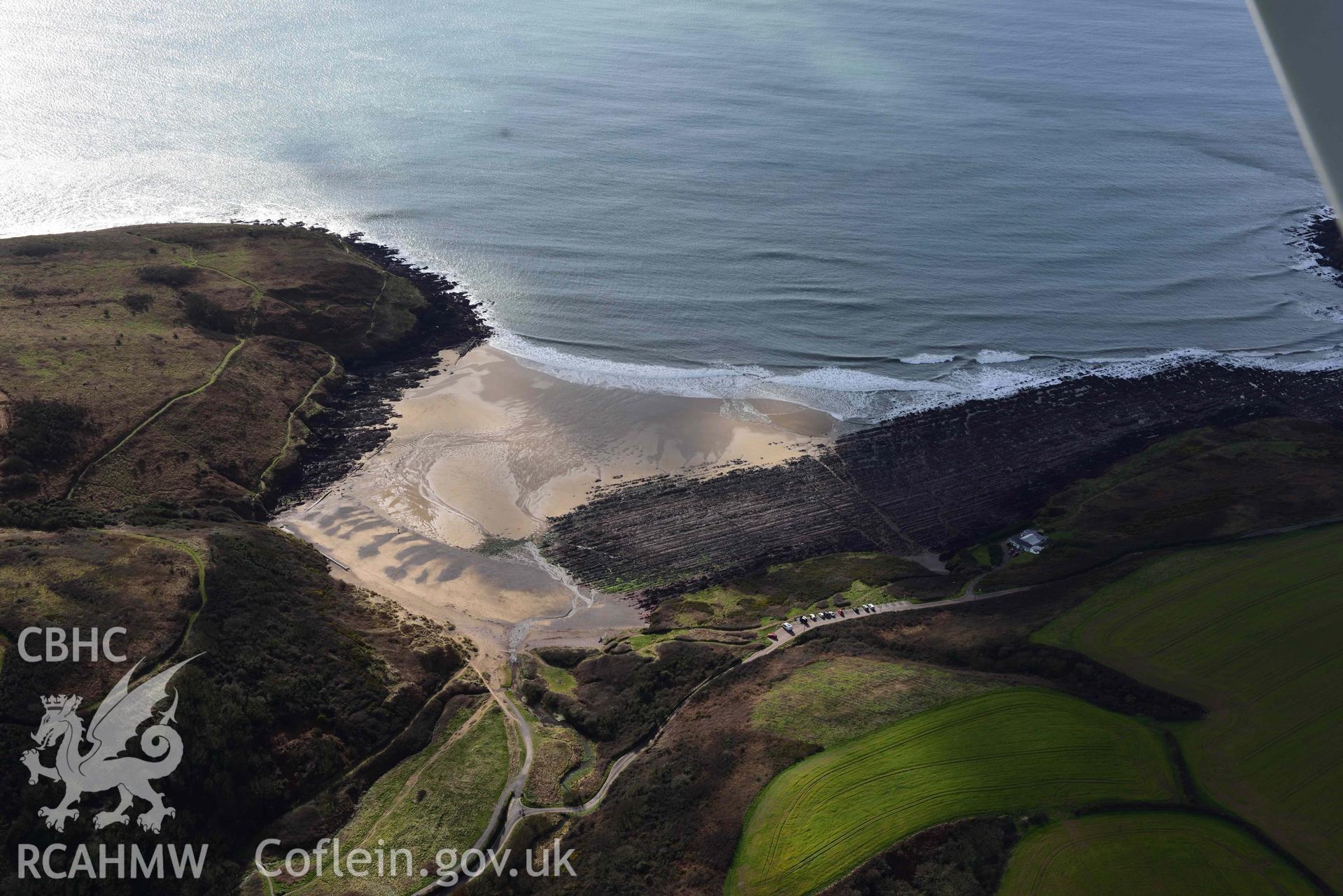 RCAHMW colour oblique aerial photograph of Manorbier Bay taken on 4 March 2022 by Toby Driver ((SS060974)