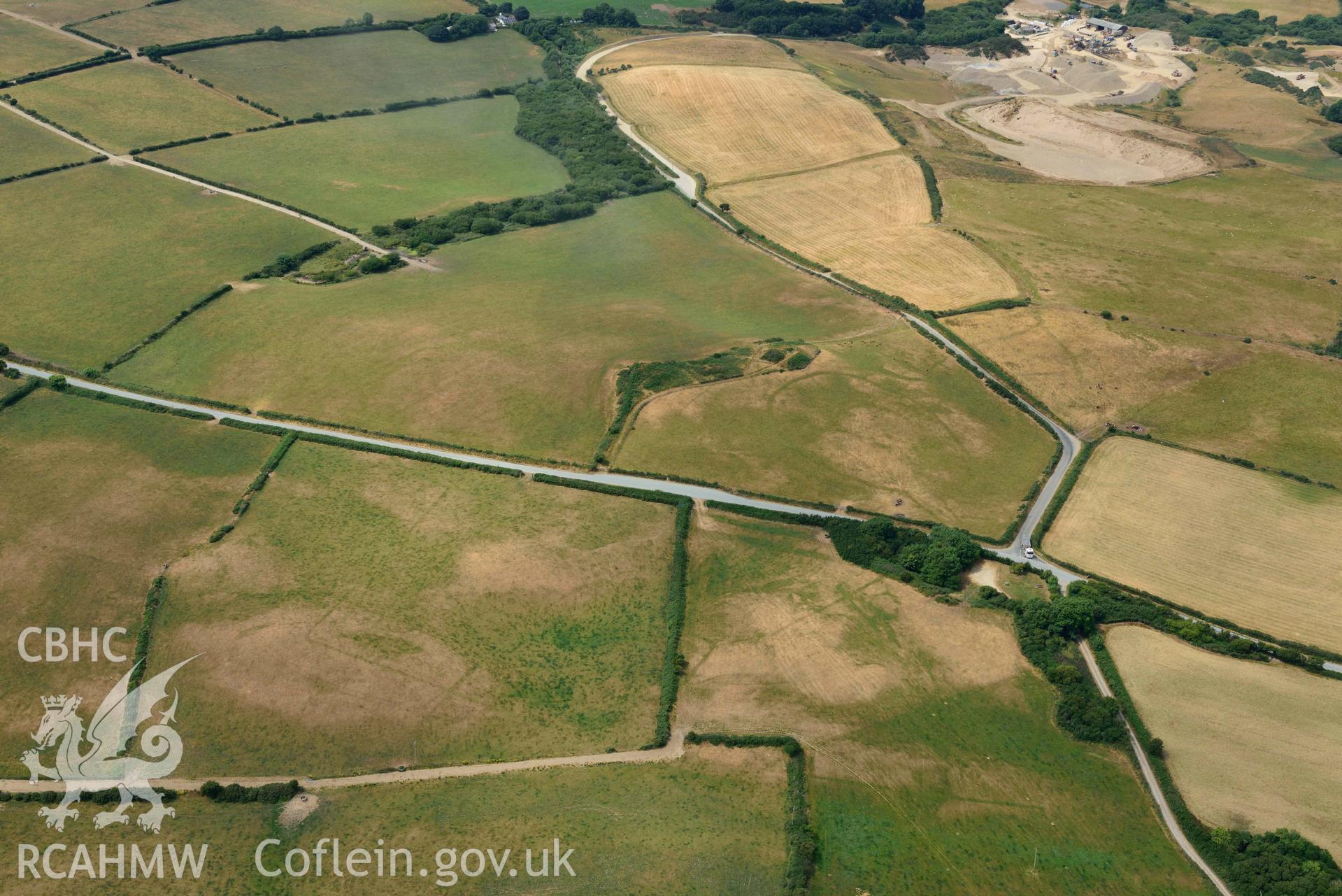 RCAHMW colour oblique aerial photograph of Crugiau Cemmaes Barrow Cemetary, Crugiau Cemmaes Banjo enclosure, Crugiau Cemmaes Southeast (Rectangular Enclosure) taken on 11 July 2018 by Toby Driver