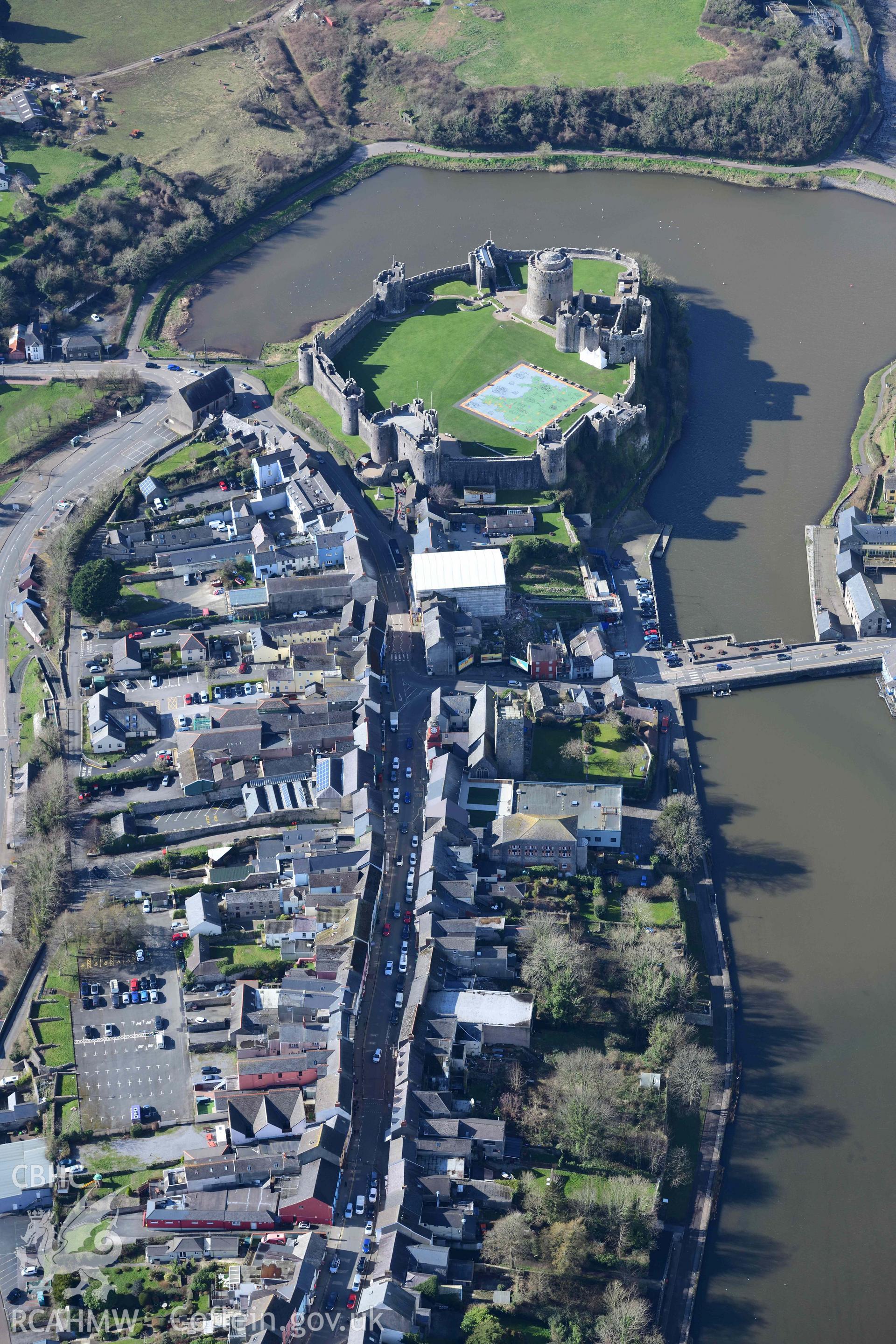 RCAHMW colour oblique aerial photograph of Pembroke town or borough, view from east and Pembroke Castle taken on 4 March 2022 by Toby Driver ((SM985014)