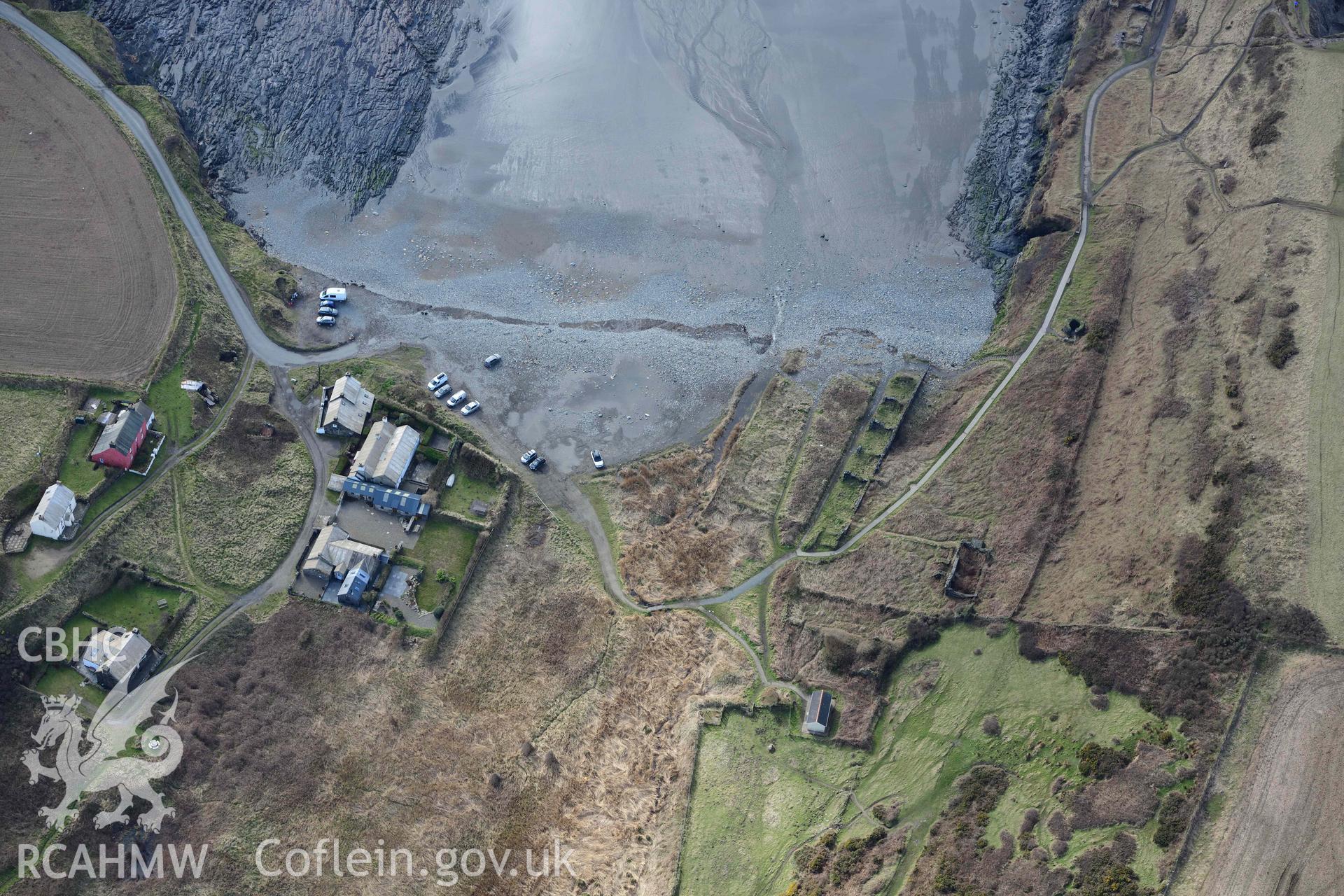 RCAHMW colour oblique aerial photograph of Porthgain terraced houseing, Abereiddi or Abereiddy Bay taken on 4 March 2022 by Toby Driver ((SM797313)