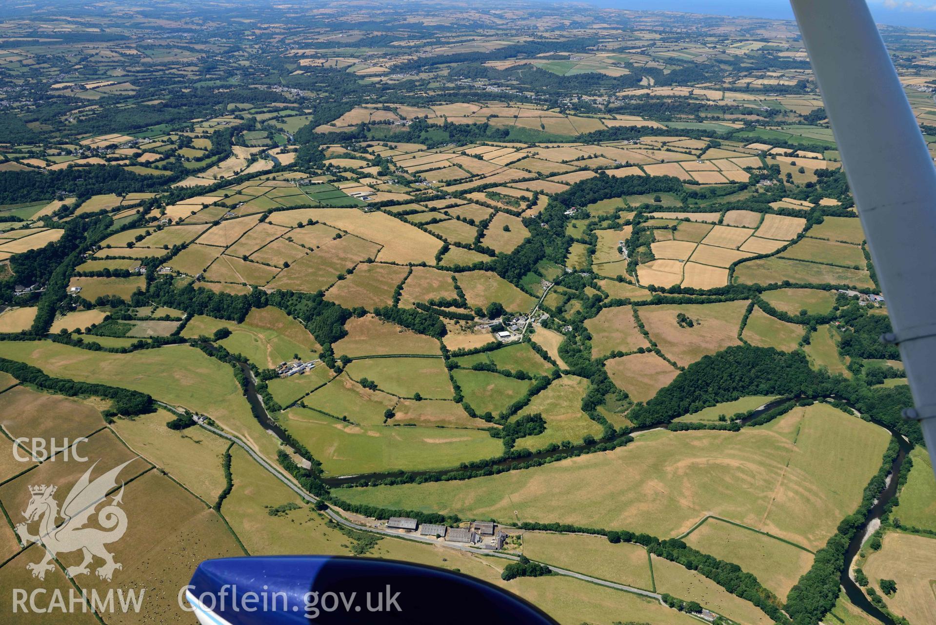 RCAHMW colour oblique aerial photograph of Allt isaf defended enclosure and Aberhoffnant complex enclosure taken on 9 July 2018 by Toby Driver