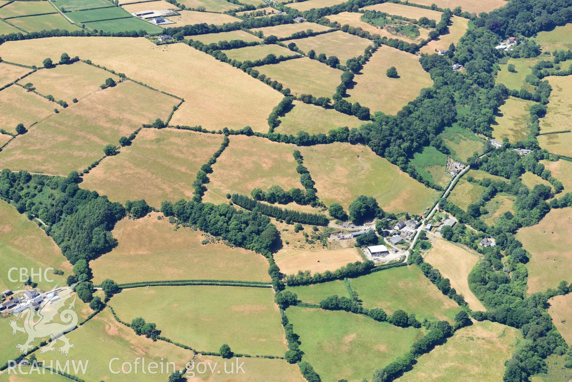 RCAHMW colour oblique aerial photograph of Aberhoffnant complex enclosure ( SN393402 ) taken on 9 July 2018 by Toby Driver