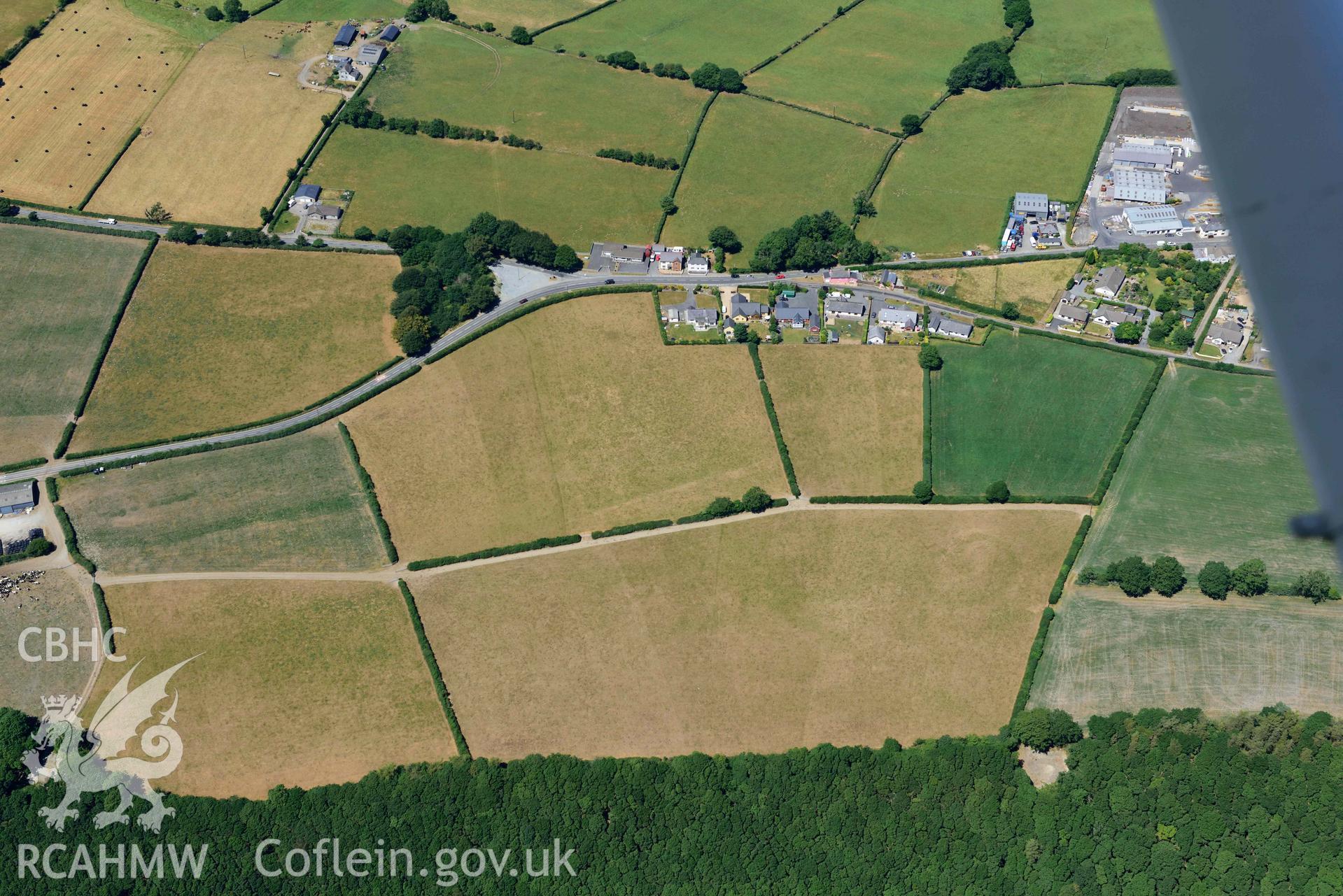 RCAHMW black and white oblique aerial photograph of Llanllwni Roman Road and Llanllwni enclosure or watchtower taken on 9 July 2018 by Toby Driver