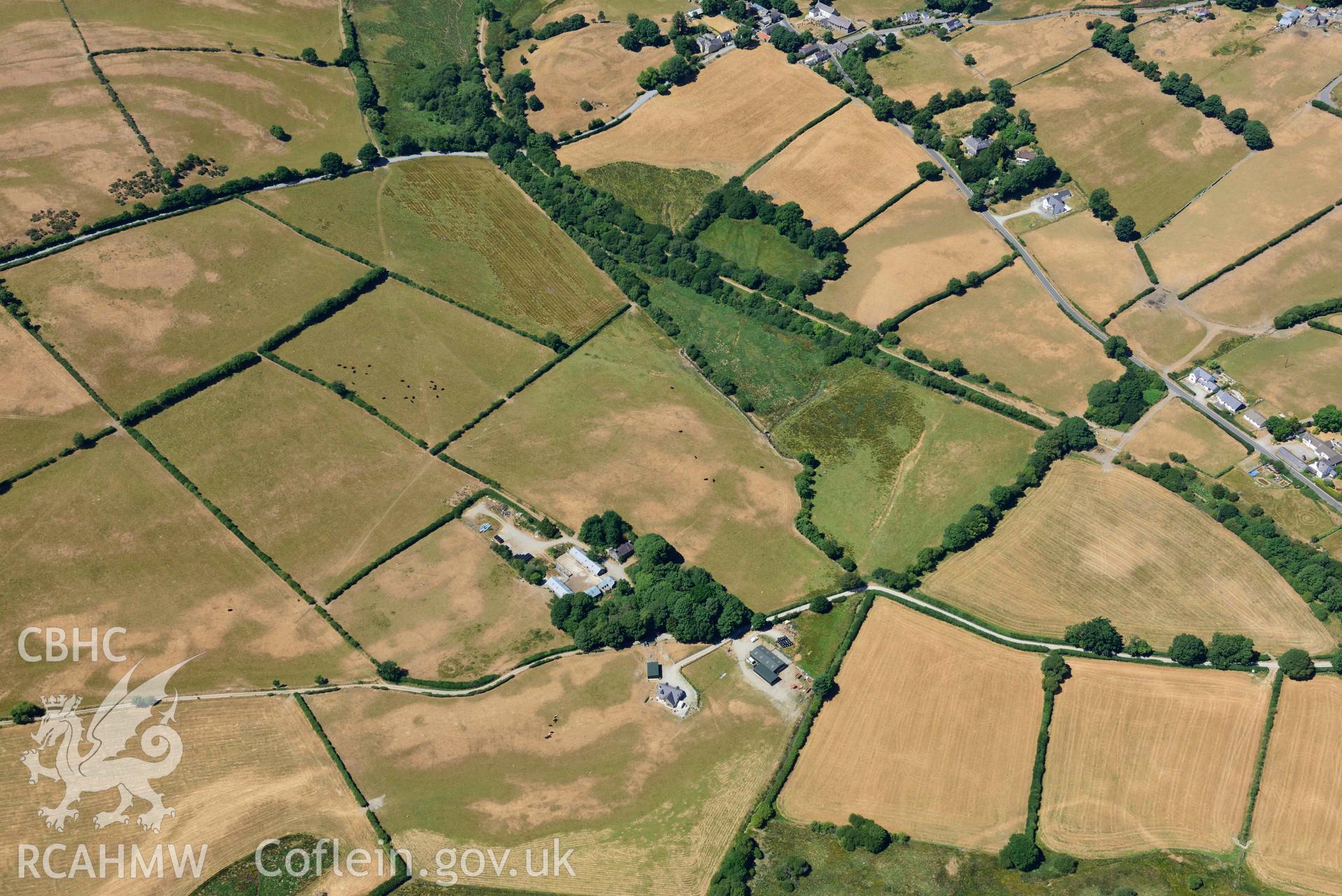 RCAHMW colour oblique aerial photograph of Maebandlog rectangular enclosure taken on 9 July 2018 by Toby Driver