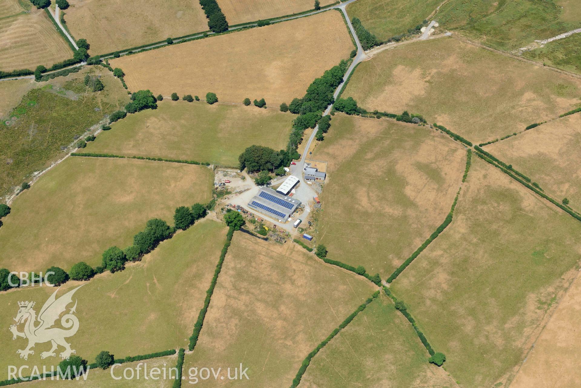 RCAHMW colour oblique aerial photograph of Llwyn y gog enclosure complex taken on 9 July 2018 by Toby Driver