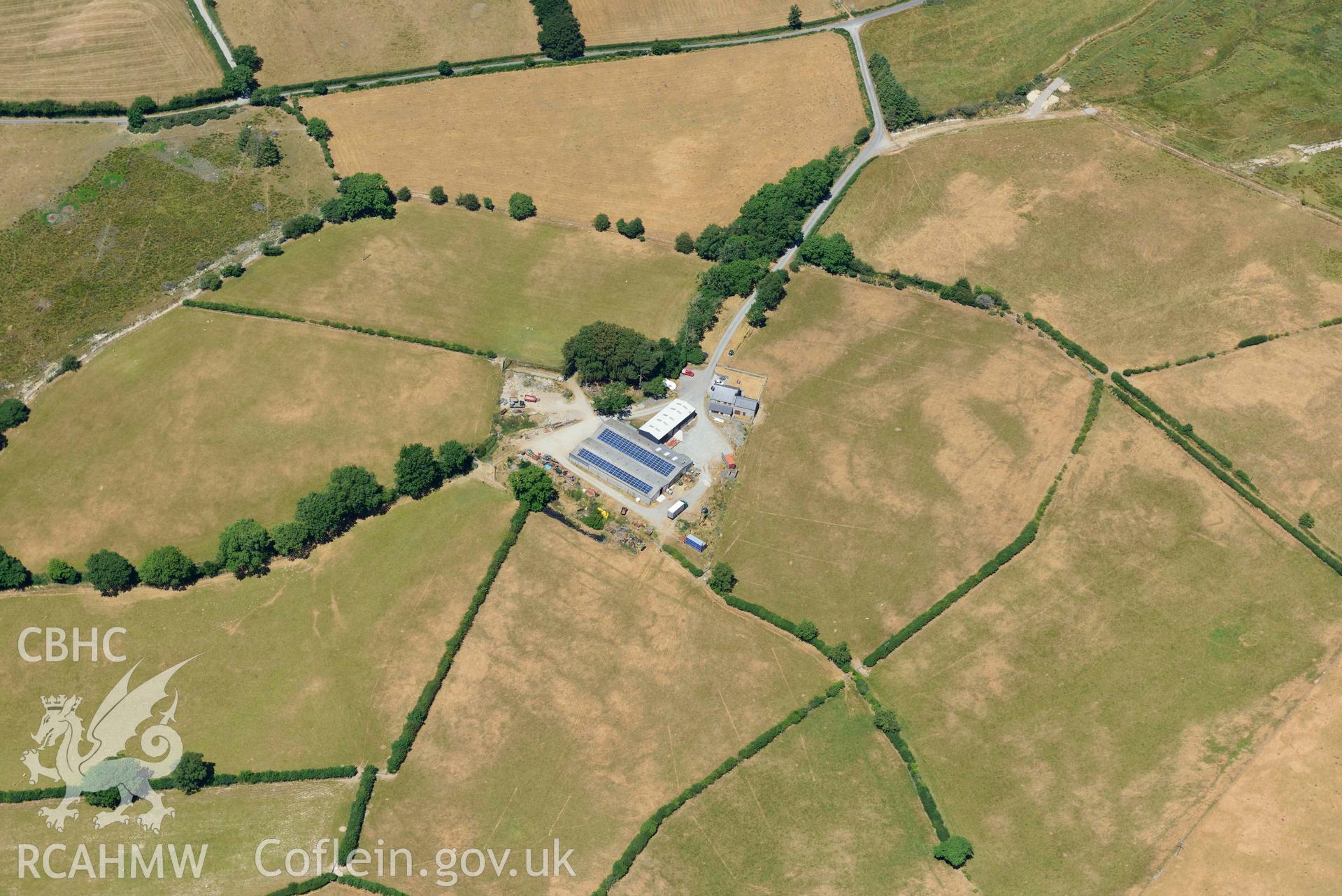 RCAHMW colour oblique aerial photograph of Llwyn y gog enclosure complex taken on 9 July 2018 by Toby Driver