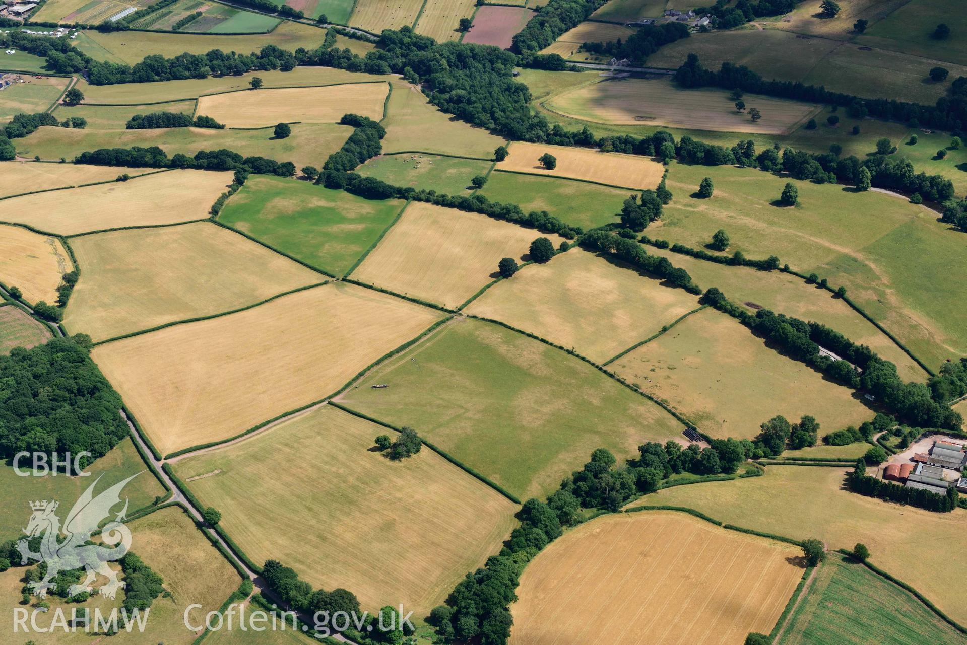 RCAHMW colour oblique aerial photograph of Abersefin cropmark enclosure taken on 9 July 2018 by Toby Driver