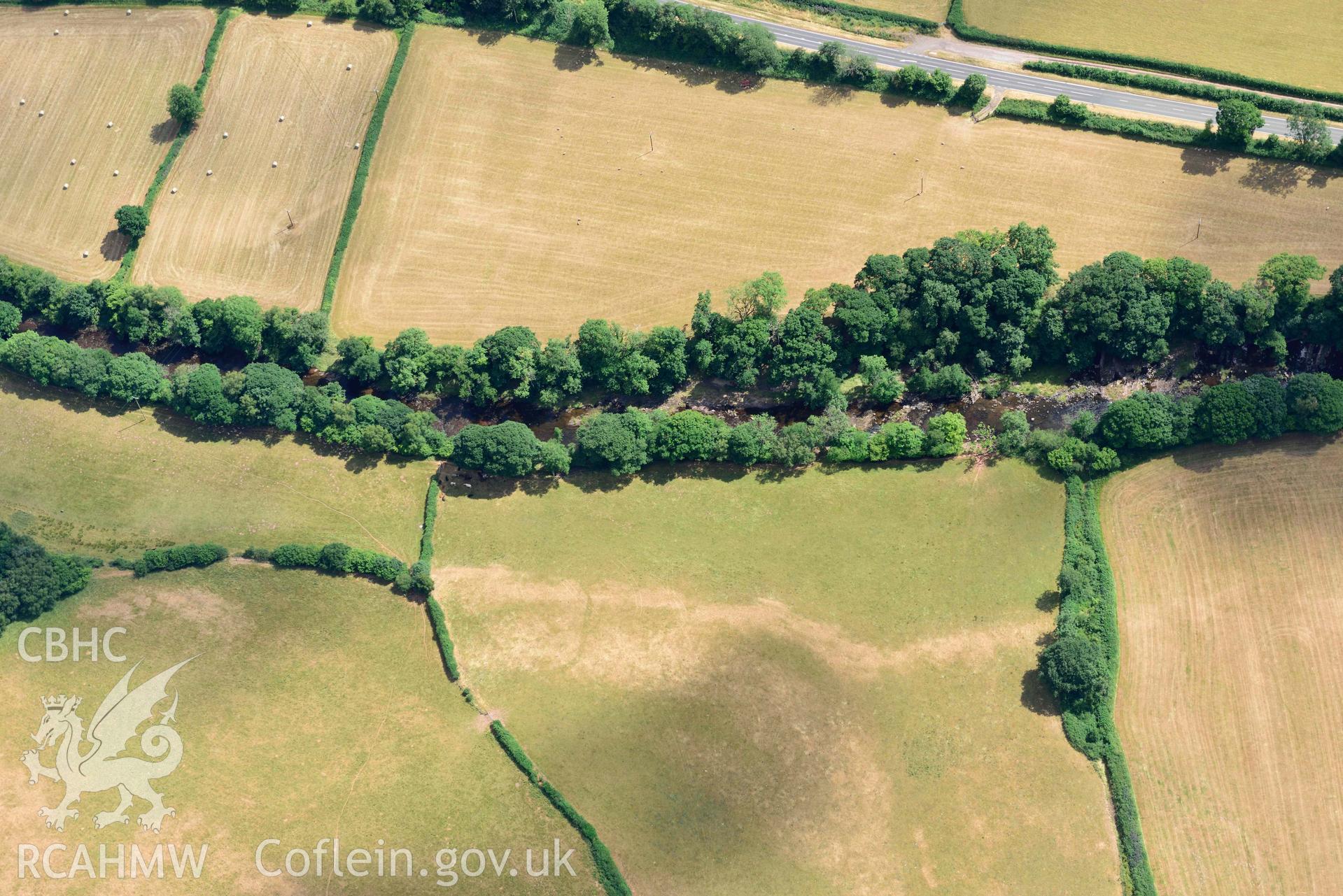 RCAHMW colour oblique aerial photograph of Pont y commin cropmark enclosure taken on 9 July 2018 by Toby Driver