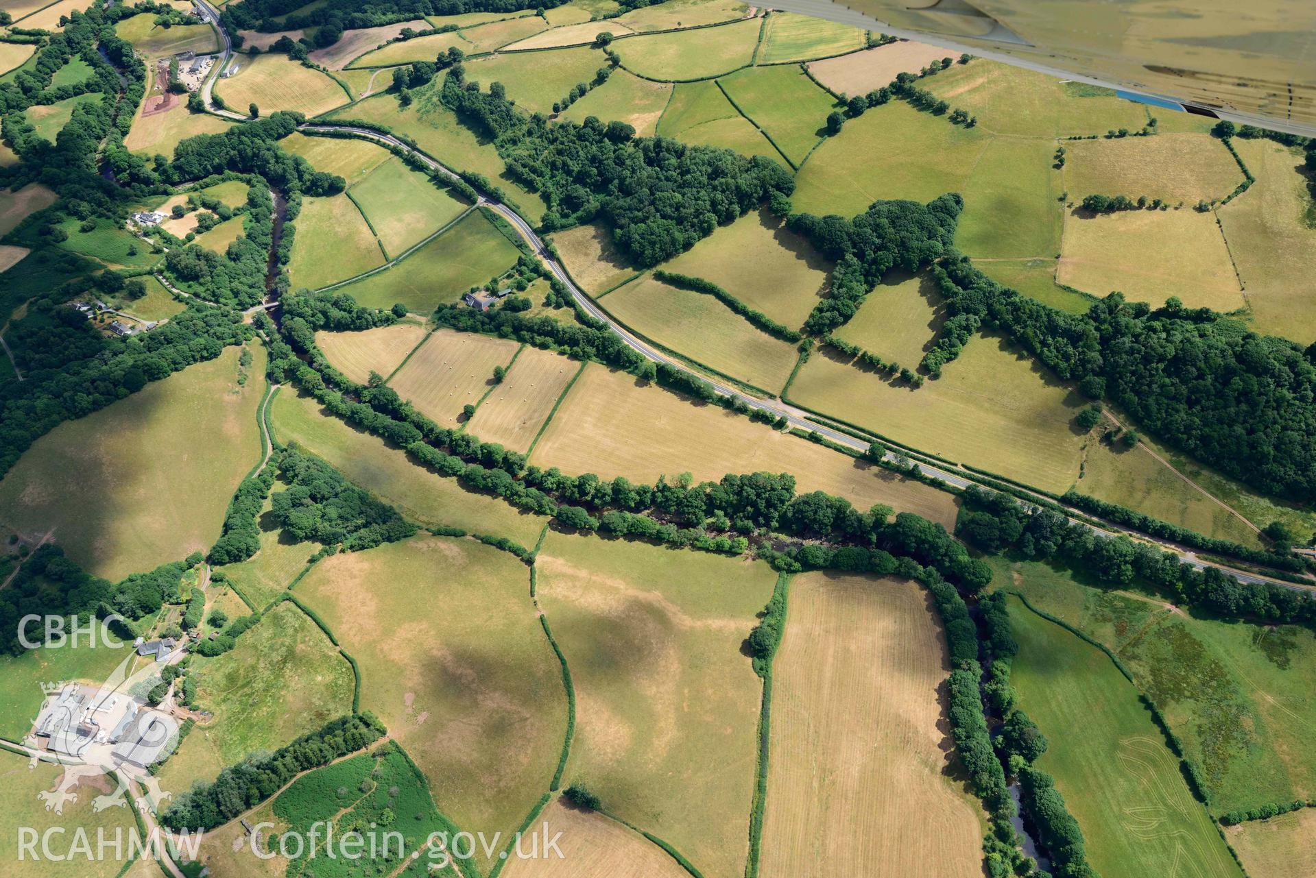 RCAHMW colour oblique aerial photograph of Pont y commin cropmark enclosure taken on 9 July 2018 by Toby Driver