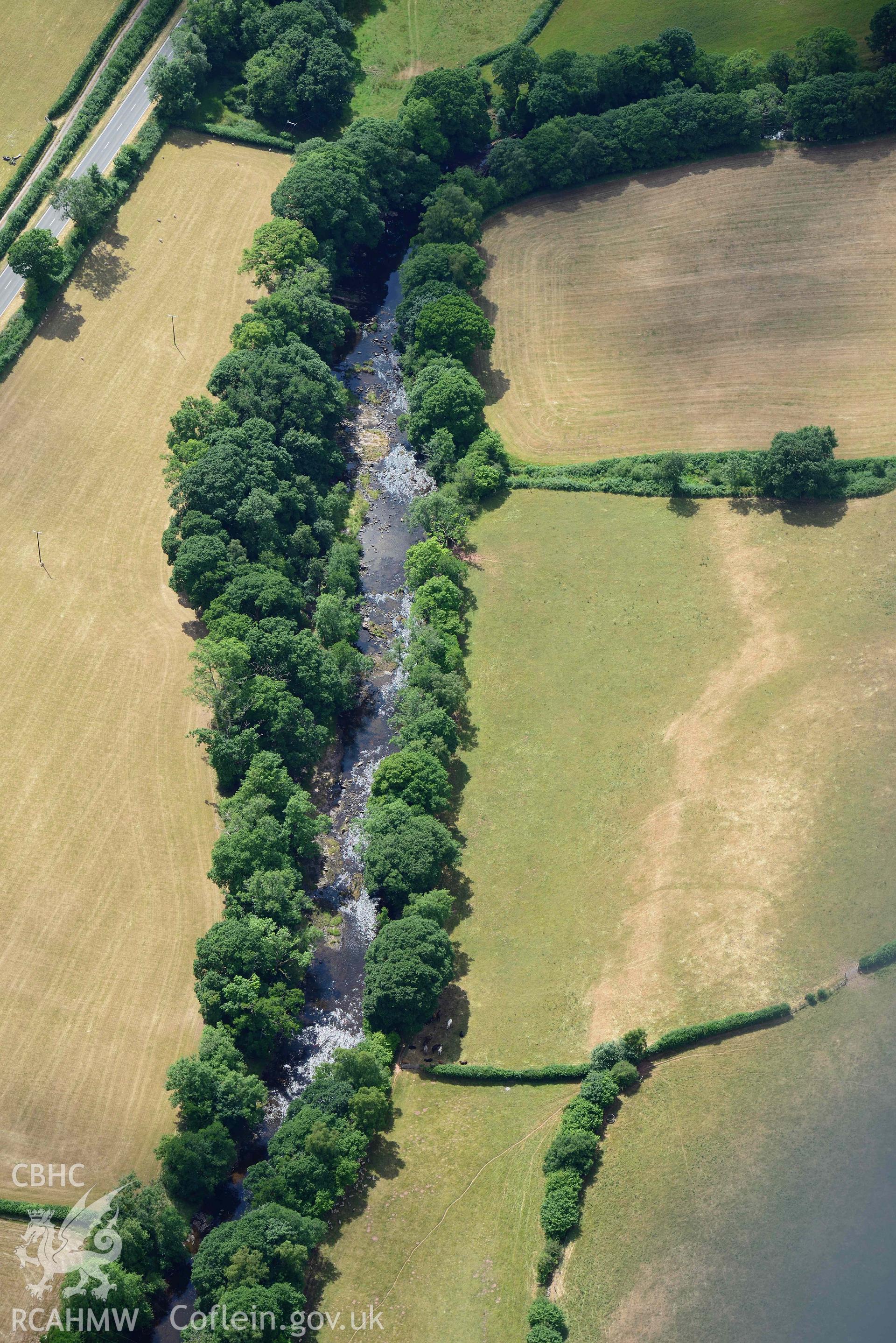 RCAHMW colour oblique aerial photograph of Pont y commin cropmark enclosure taken on 9 July 2018 by Toby Driver