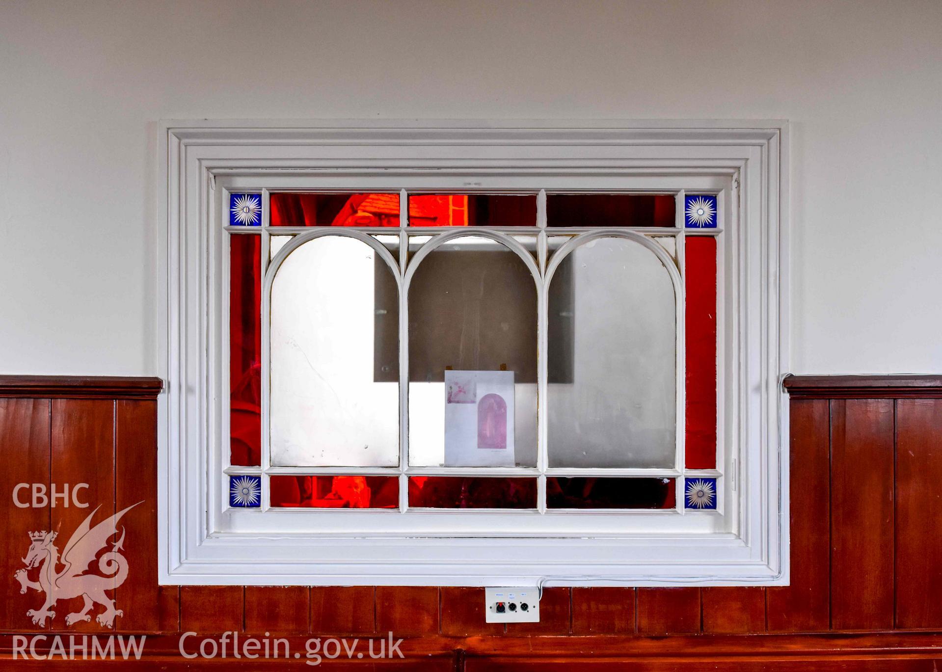 Tabernacl Welsh Independent Chapel - View of a stained-glass window between the nave and the narthex, taken from North