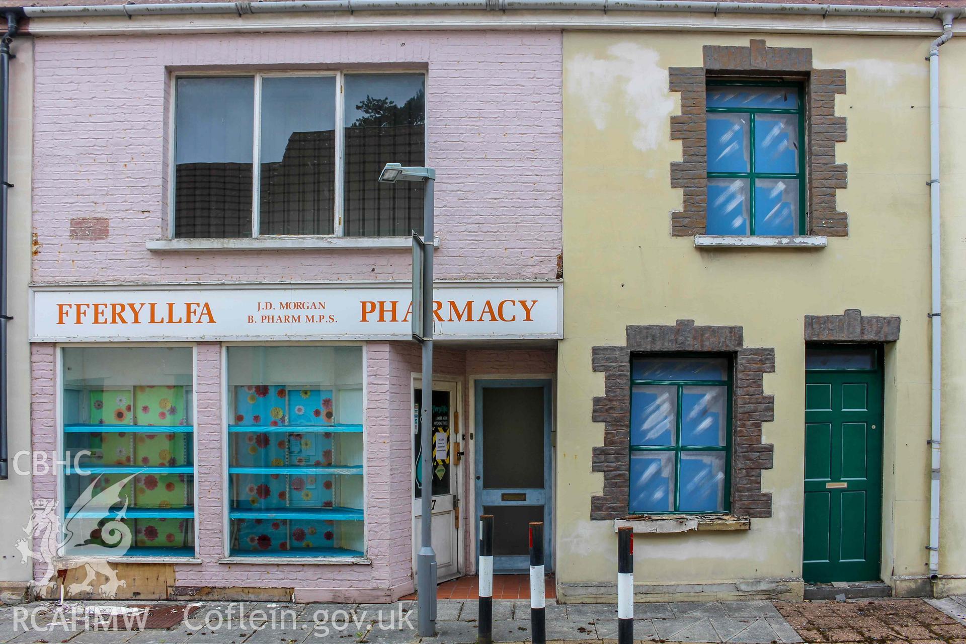Pobl Y Cwm Set - Exterior, View of the pharmacy and an adjacent house on High Street, taken from South-East