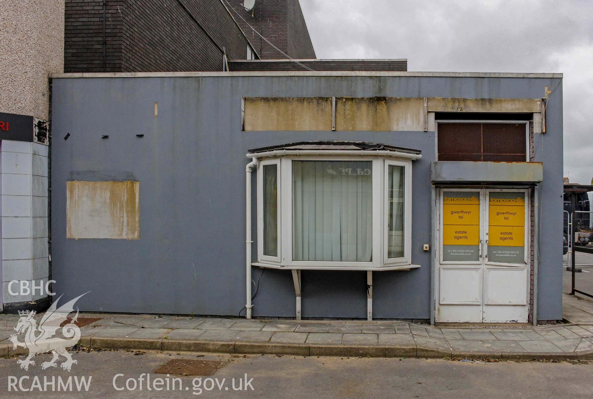 Pobl Y Cwm Set - Exterior, View of Tomos ac Ellis estate agents adjacent to Dyfed Bank, taken from East