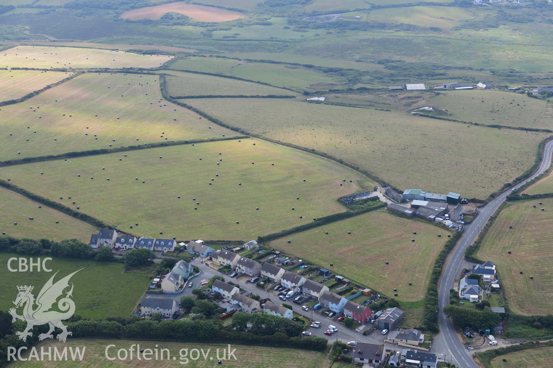Bay View Farm defended enclosure, visible as a cropmark in a stubble field. © Crown: CHERISH PROJECT 2017. Produced with EU funds through the Ireland Wales Co-operation Programme 2014-2023.