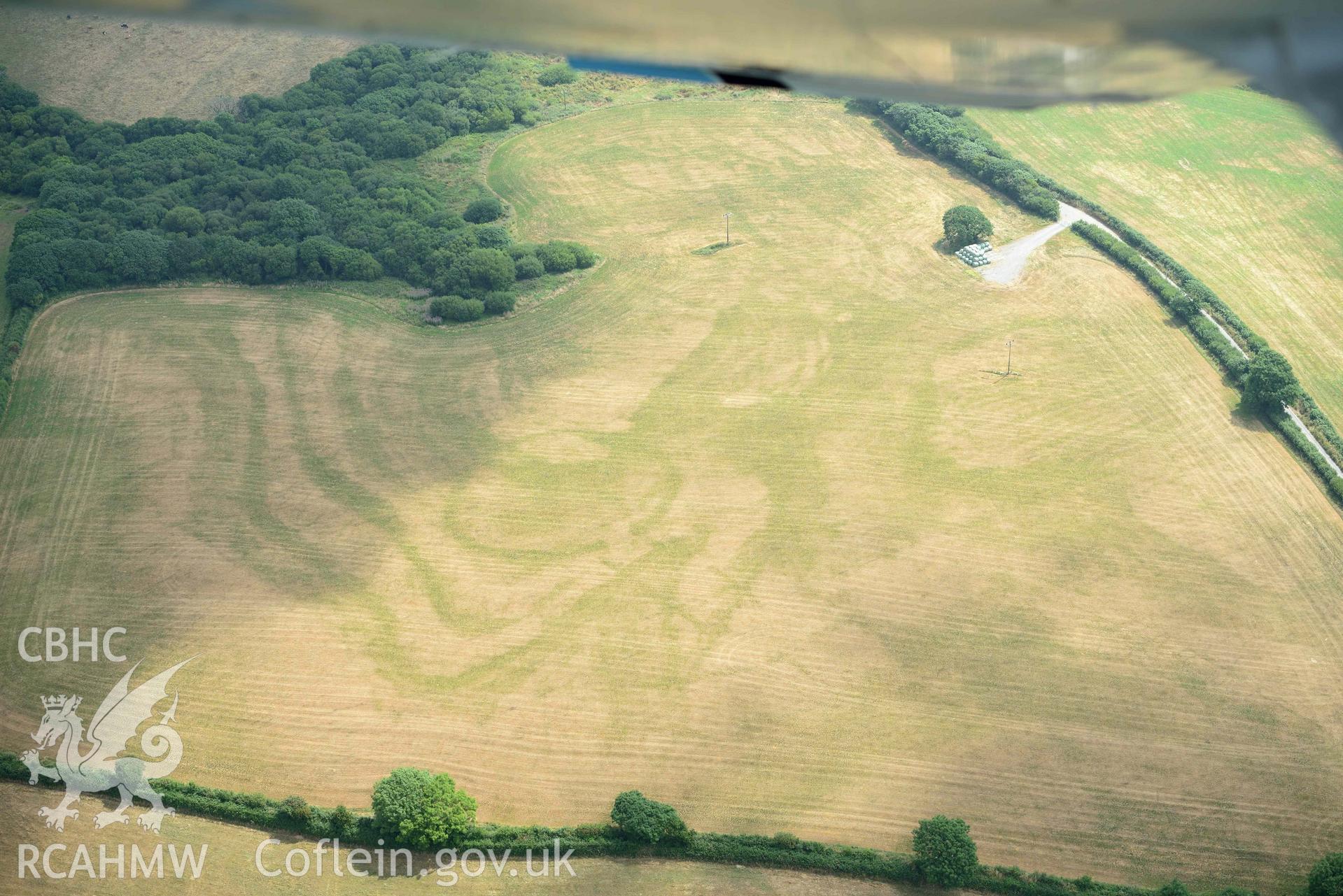 Aerial photography of Island gate farm defended enclosure Aerial reconnaissance survey for the CHERISH Project. Crown Copyright: CHERISH PROJECT 2018. Produced with EU funds through the Ireland Wales Co-operation Programme 2014-2020. All material made freely available through the Open Government Licence.