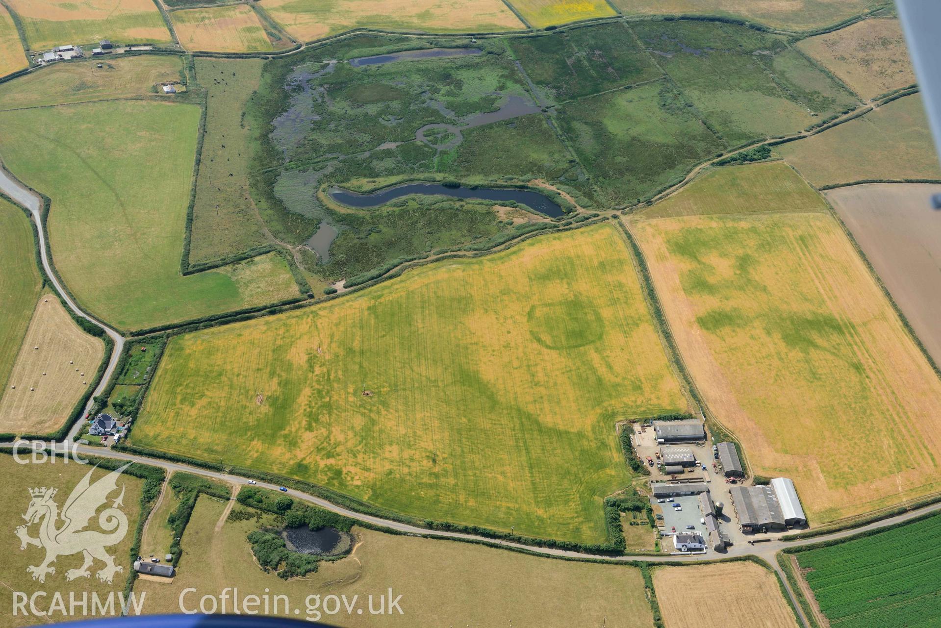 Aerial photography of Trehill Farm defended enclosure, Marloes Aerial reconnaissance survey for the CHERISH Project. Crown Copyright: CHERISH PROJECT 2018. Produced with EU funds through the Ireland Wales Co-operation Programme 2014-2020. All material made freely available through the Open Government Licence.