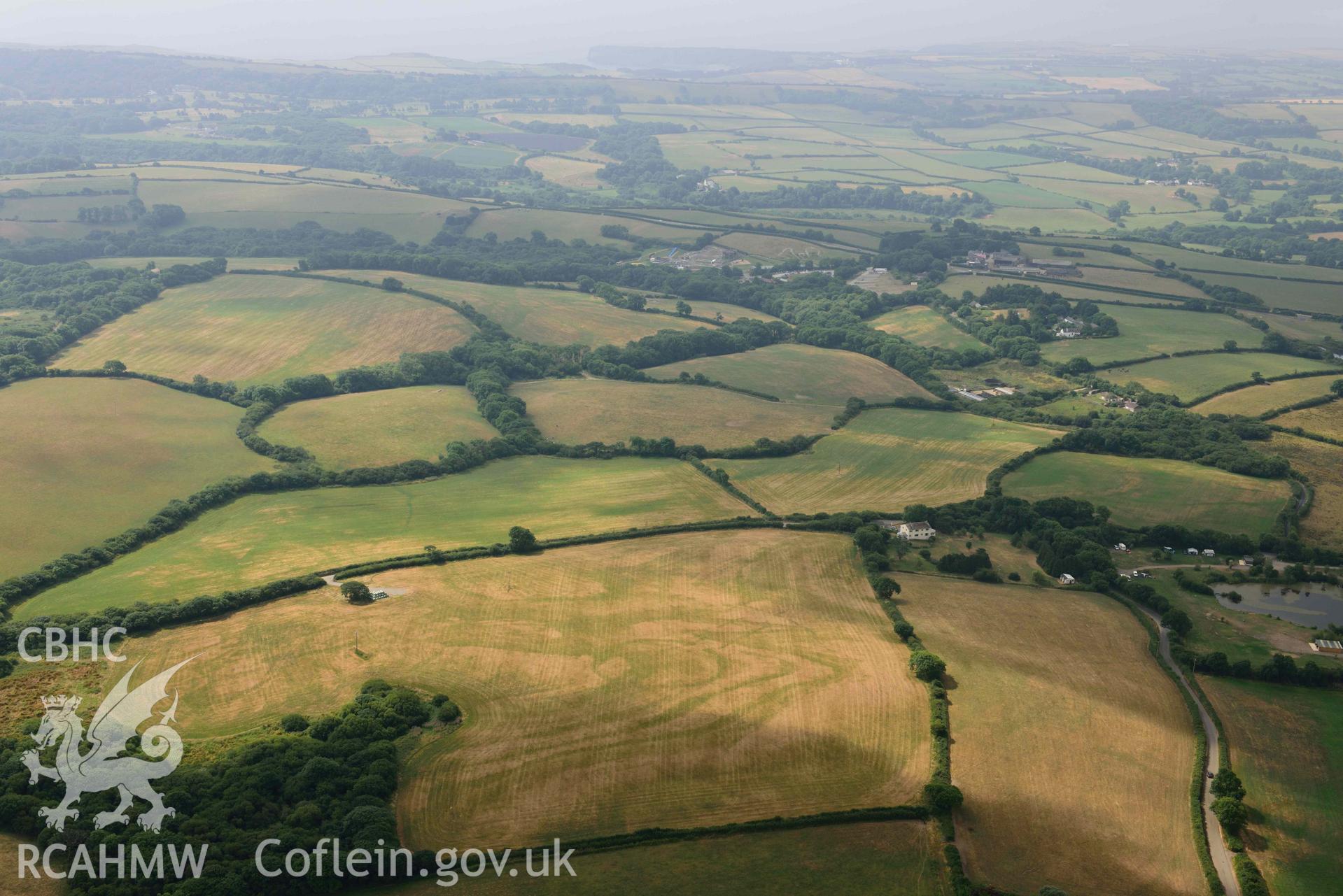 Aerial photography of Island gate farm defended enclosure Aerial reconnaissance survey for the CHERISH Project. Crown Copyright: CHERISH PROJECT 2018. Produced with EU funds through the Ireland Wales Co-operation Programme 2014-2020. All material made freely available through the Open Government Licence.