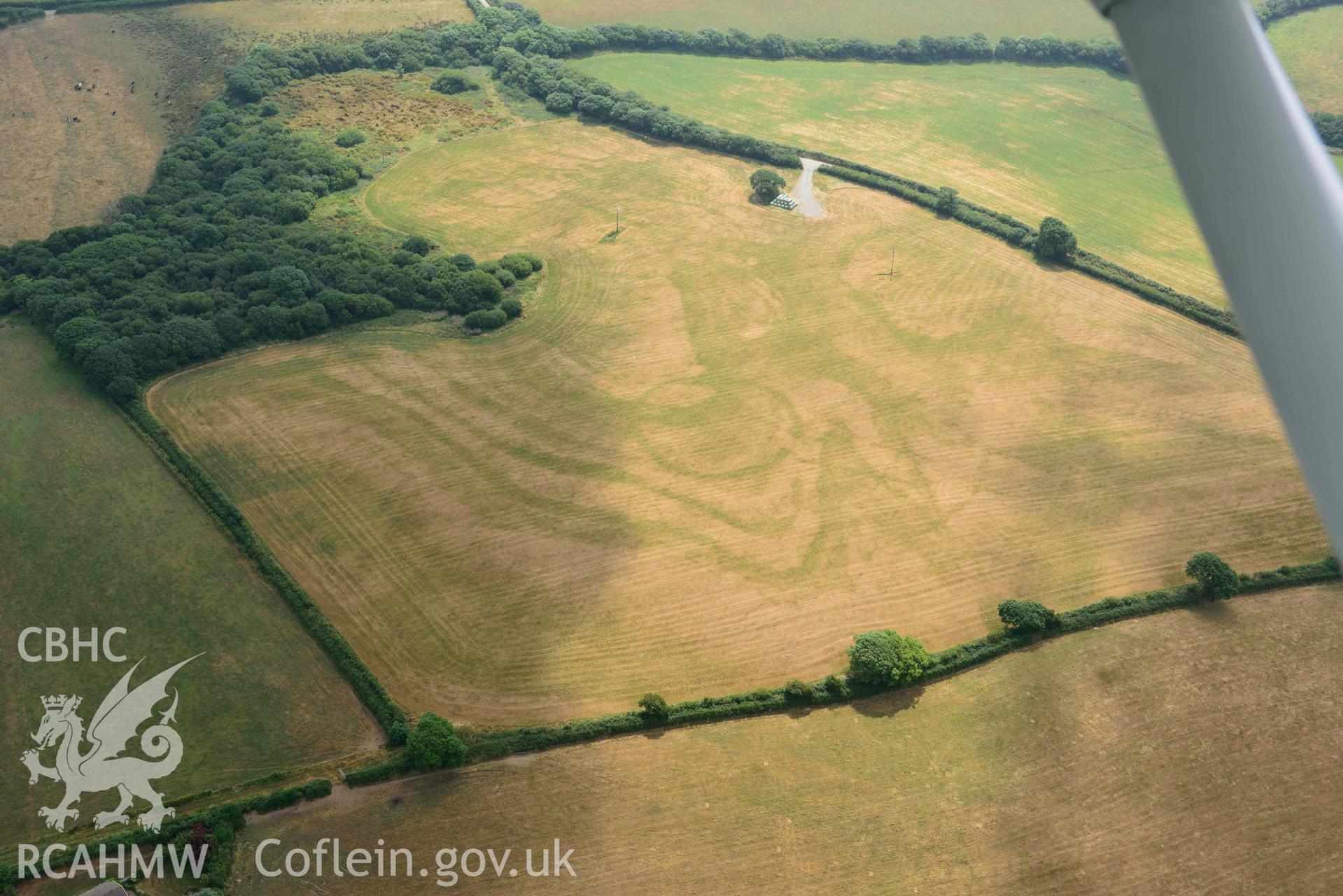 Aerial photography of Island gate farm defended enclosure Aerial reconnaissance survey for the CHERISH Project. Crown Copyright: CHERISH PROJECT 2018. Produced with EU funds through the Ireland Wales Co-operation Programme 2014-2020. All material made freely available through the Open Government Licence.