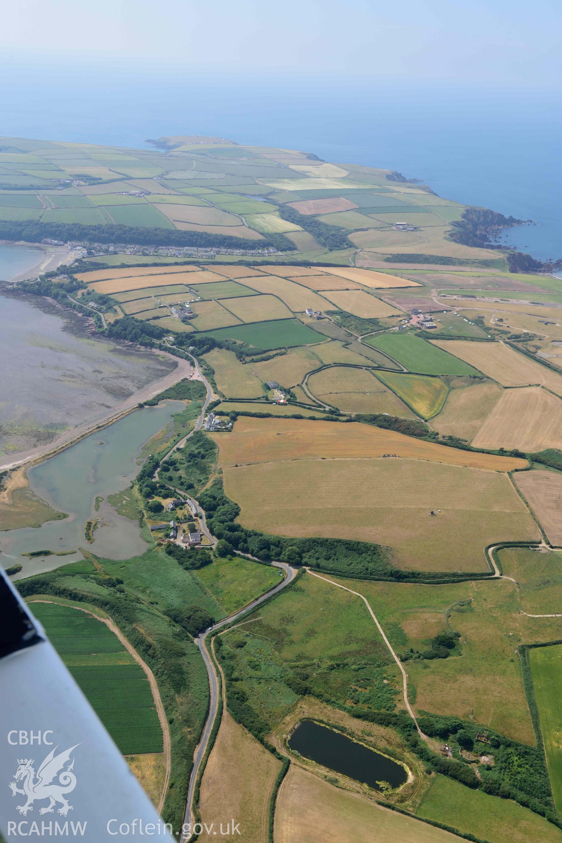 Aerial photography of Dale village, summer landscape from St Ishmaels Aerial reconnaissance survey for the CHERISH Project. Crown Copyright: CHERISH PROJECT 2018. Produced with EU funds through the Ireland Wales Co-operation Programme 2014-2020. All material made freely available through the Open Government Licence.