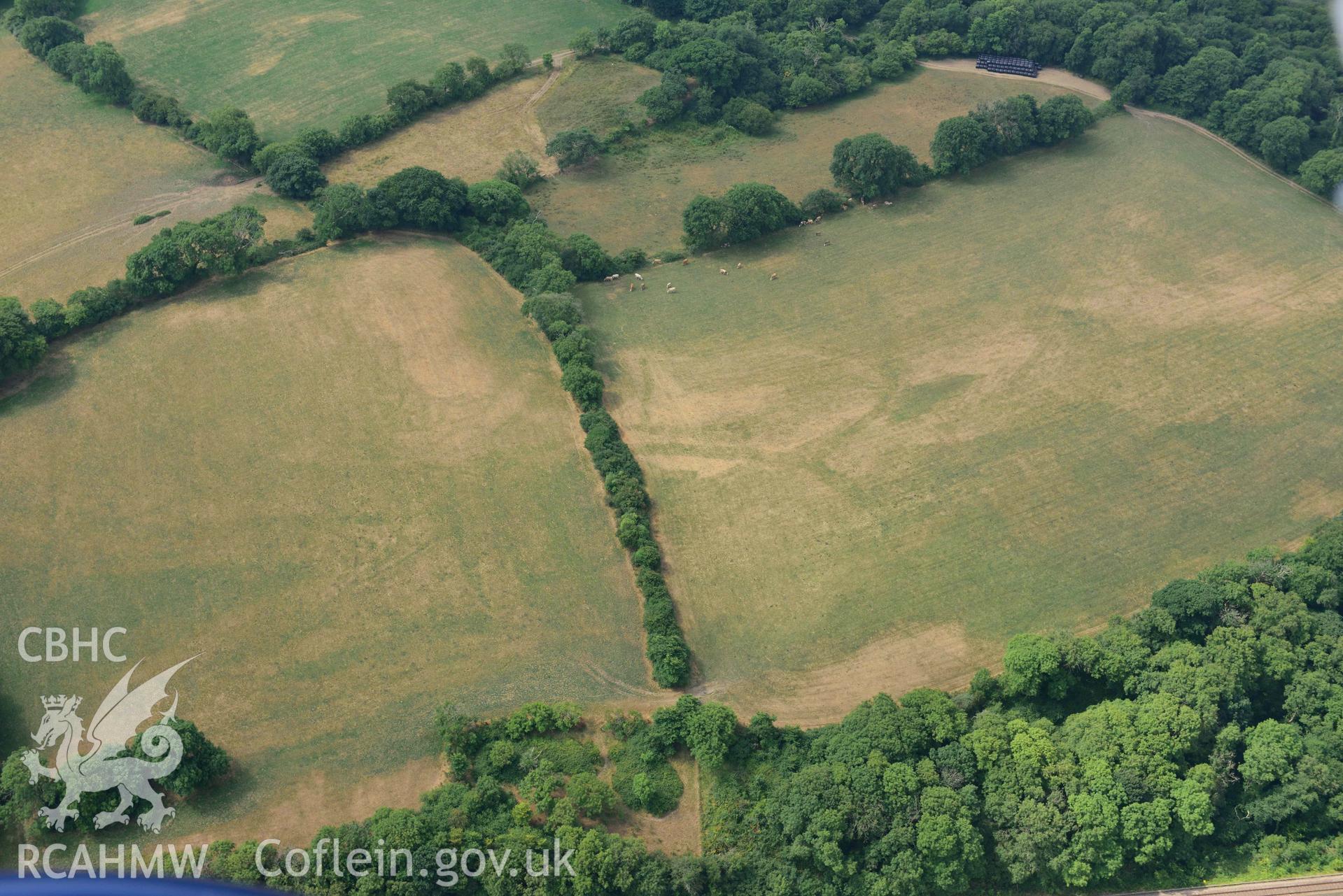 Aerial photography of Castle hill doubled defended enclosure Aerial reconnaissance survey for the CHERISH Project. Crown Copyright: CHERISH PROJECT 2018. Produced with EU funds through the Ireland Wales Co-operation Programme 2014-2020. All material made freely available through the Open Government Licence.