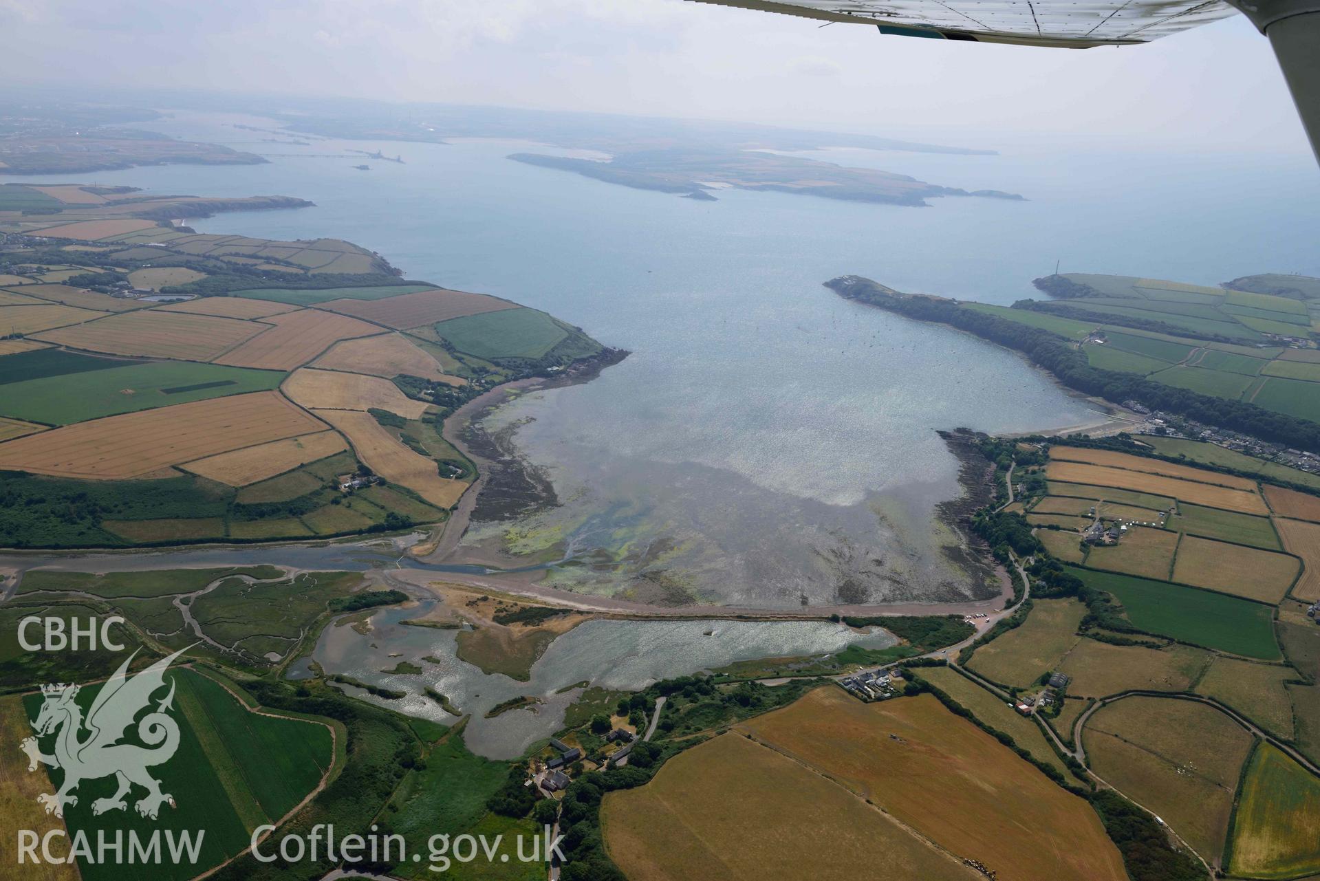 Aerial photography of Dale village, summer landscape from St Ishmaels Aerial reconnaissance survey for the CHERISH Project. Crown Copyright: CHERISH PROJECT 2018. Produced with EU funds through the Ireland Wales Co-operation Programme 2014-2020. All material made freely available through the Open Government Licence.