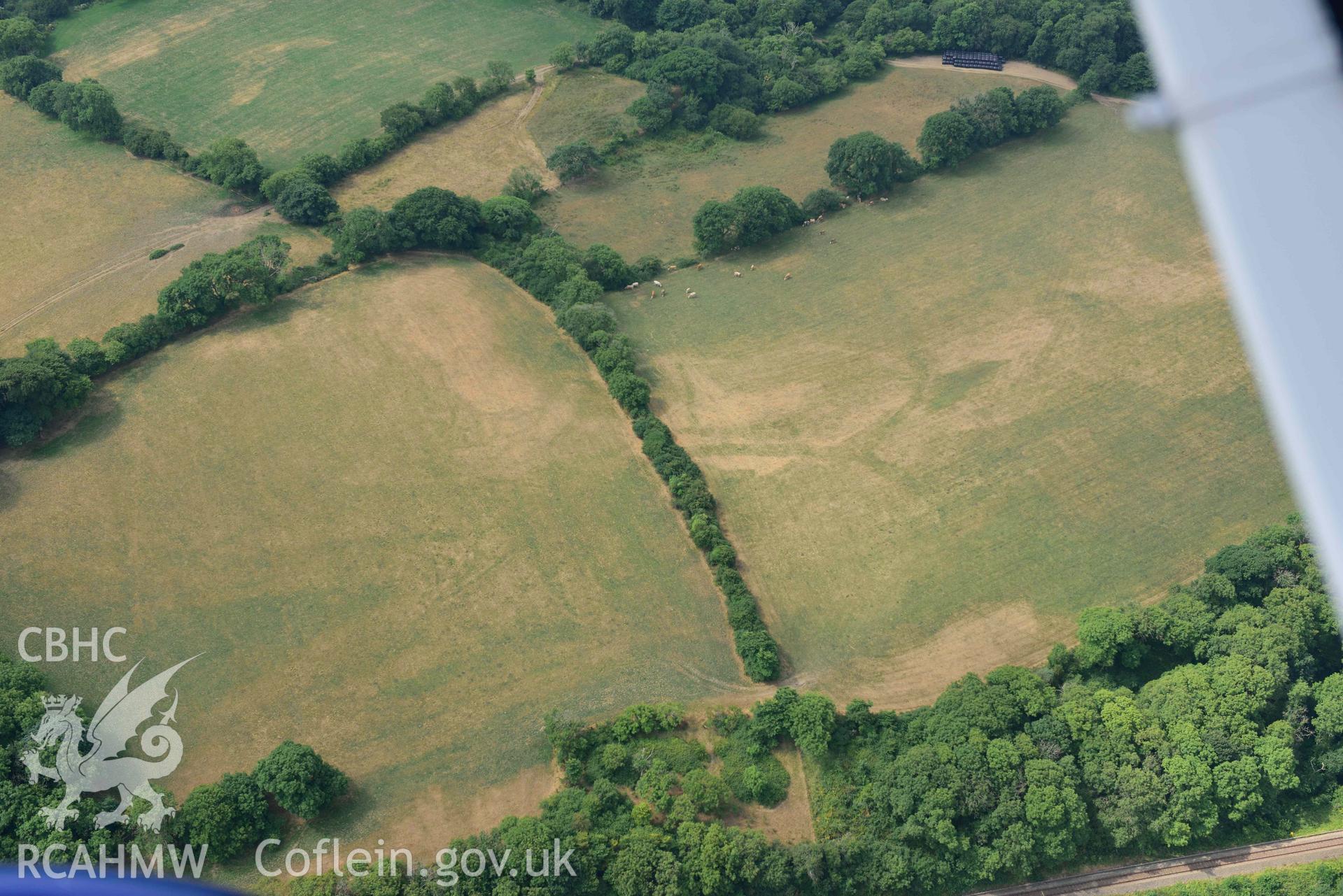 Aerial photography of Castle hill doubled defended enclosure Aerial reconnaissance survey for the CHERISH Project. Crown Copyright: CHERISH PROJECT 2018. Produced with EU funds through the Ireland Wales Co-operation Programme 2014-2020. All material made freely available through the Open Government Licence.