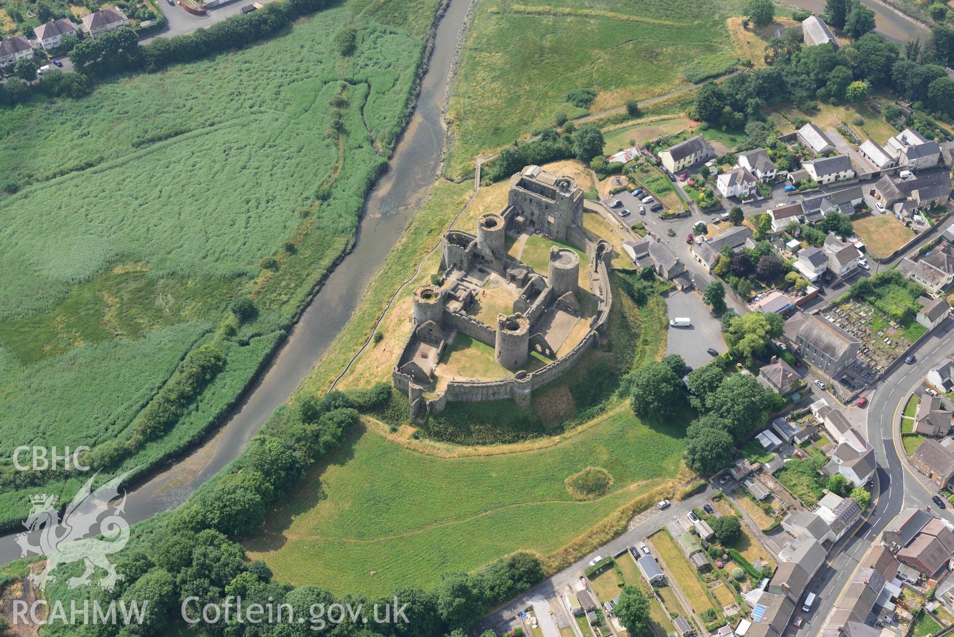 Aerial photography of Kidwelly Castle Aerial reconnaissance survey for the CHERISH Project. Crown Copyright: CHERISH PROJECT 2018. Produced with EU funds through the Ireland Wales Co-operation Programme 2014-2020. All material made freely available through the Open Government Licence.