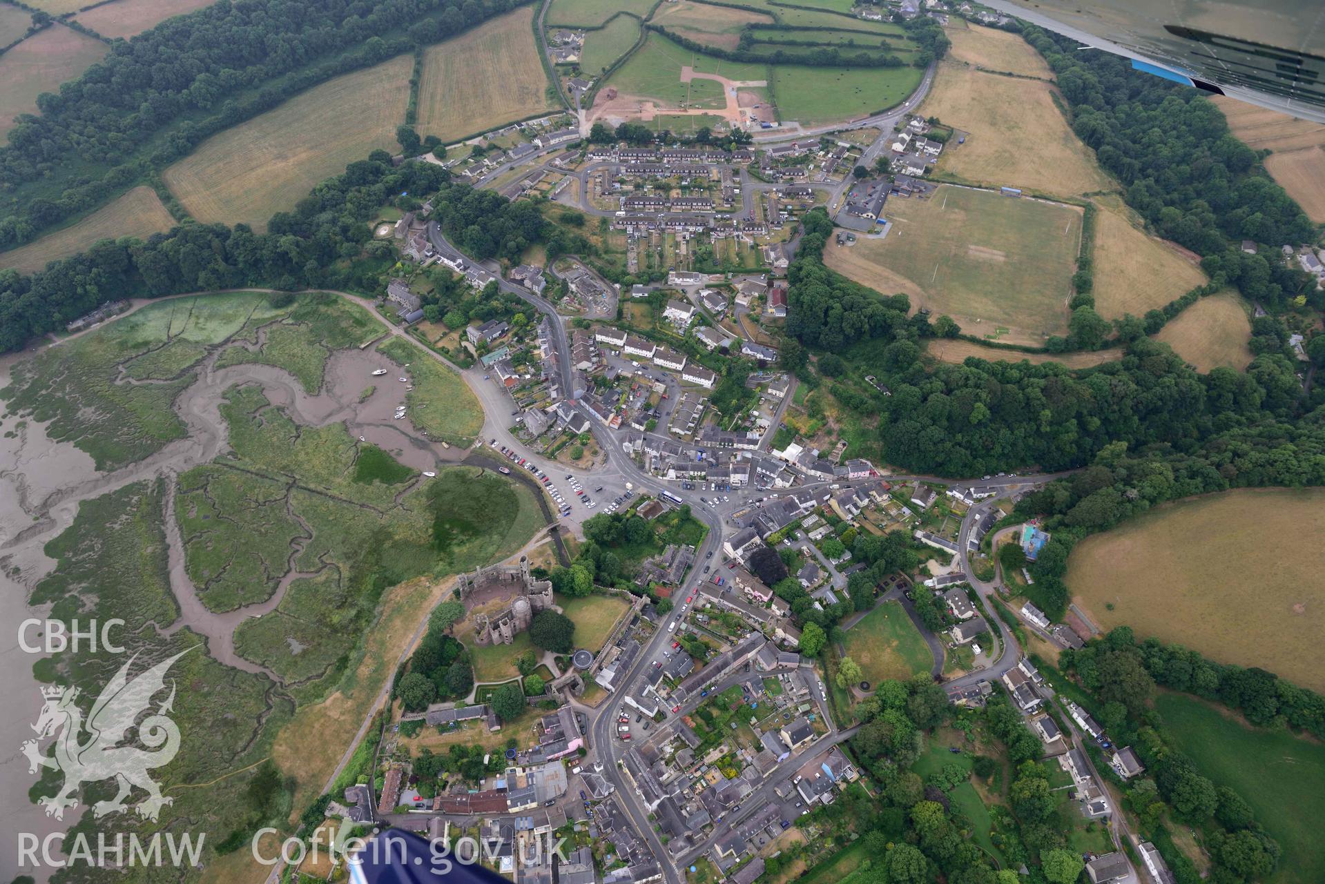 Aerial photography of Laugharne castle and harbour Aerial reconnaissance survey for the CHERISH Project. Crown Copyright: CHERISH PROJECT 2018. Produced with EU funds through the Ireland Wales Co-operation Programme 2014-2020. All material made freely available through the Open Government Licence.