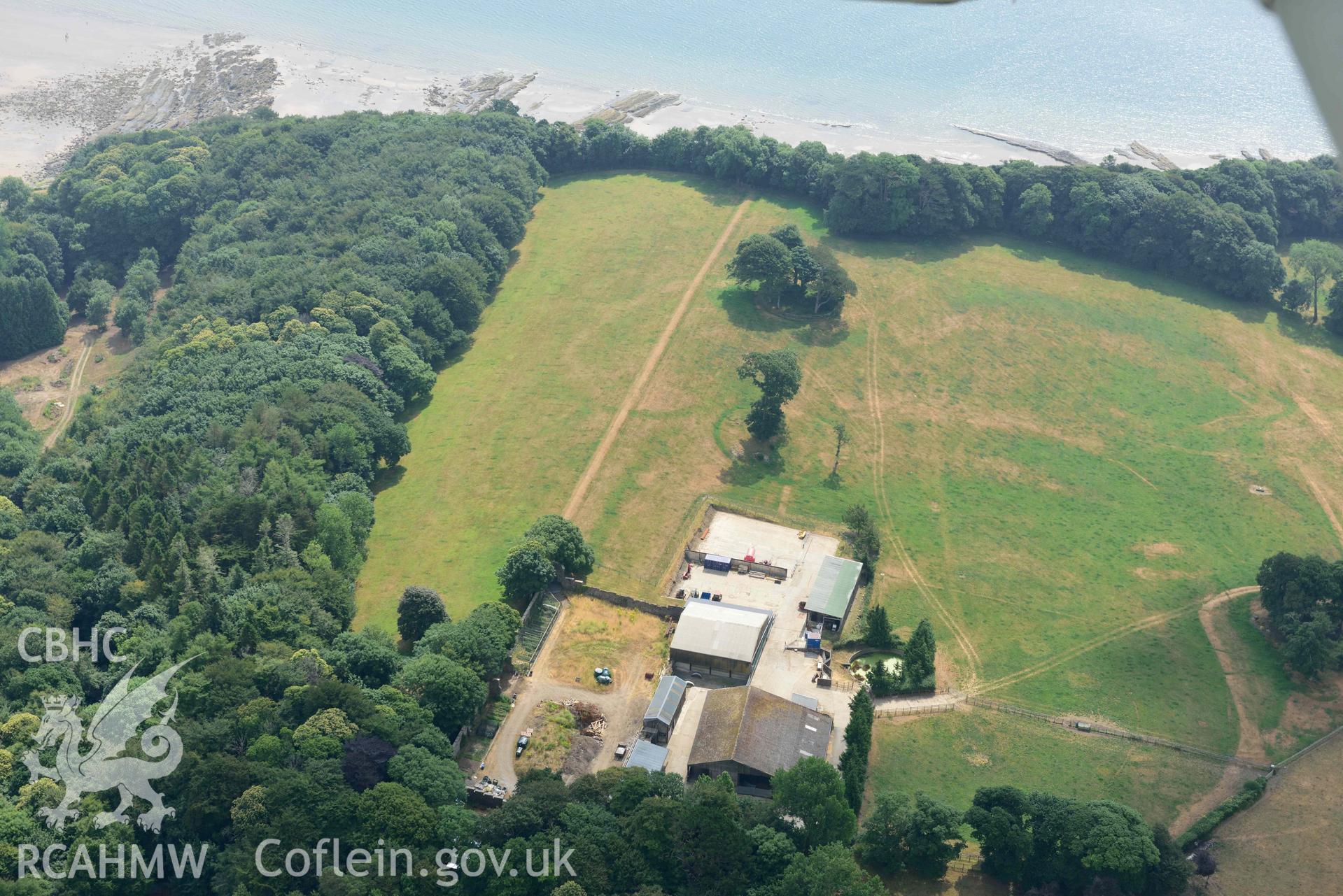 Aerial photography of Hean Castle defended enclosure Aerial reconnaissance survey for the CHERISH Project. Crown Copyright: CHERISH PROJECT 2018. Produced with EU funds through the Ireland Wales Co-operation Programme 2014-2020. All material made freely available through the Open Government Licence.