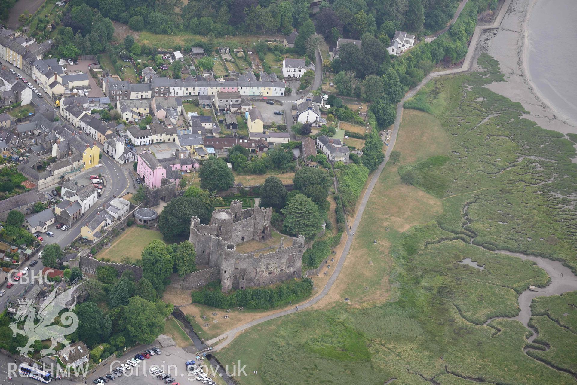 Aerial photography of Laugharne castle and harbour Aerial reconnaissance survey for the CHERISH Project. Crown Copyright: CHERISH PROJECT 2018. Produced with EU funds through the Ireland Wales Co-operation Programme 2014-2020. All material made freely available through the Open Government Licence.