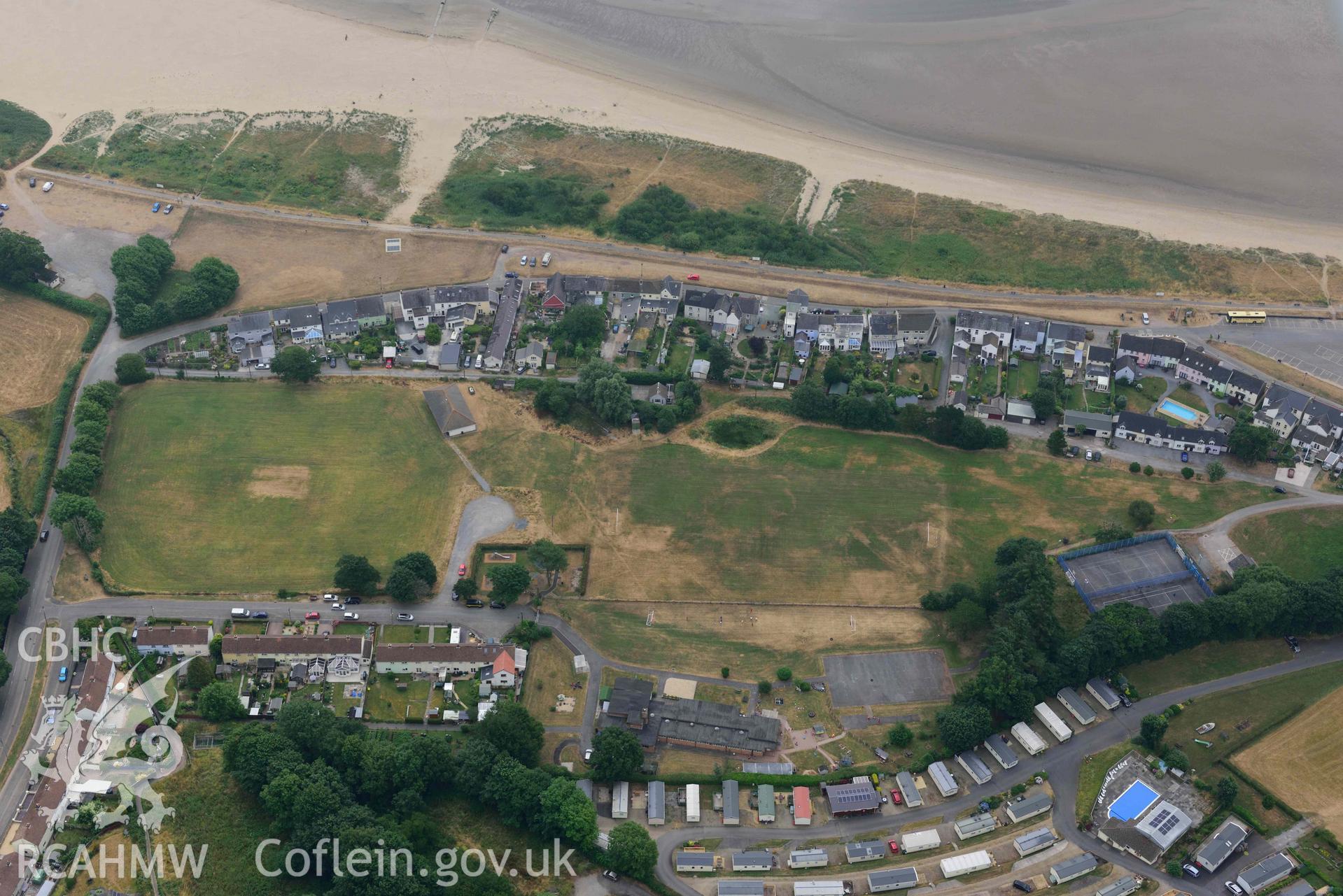 Aerial photography of Llansteffan village,  parchmarks on the Green Aerial reconnaissance survey for the CHERISH Project. Crown Copyright: CHERISH PROJECT 2018. Produced with EU funds through the Ireland Wales Co-operation Programme 2014-2020. All material made freely available through the Open Government Licence.