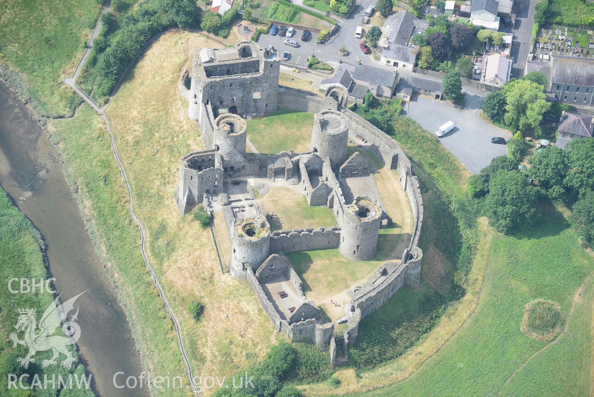 Aerial photography of Kidwelly Castle Aerial reconnaissance survey for the CHERISH Project. Crown Copyright: CHERISH PROJECT 2018. Produced with EU funds through the Ireland Wales Co-operation Programme 2014-2020. All material made freely available through the Open Government Licence.