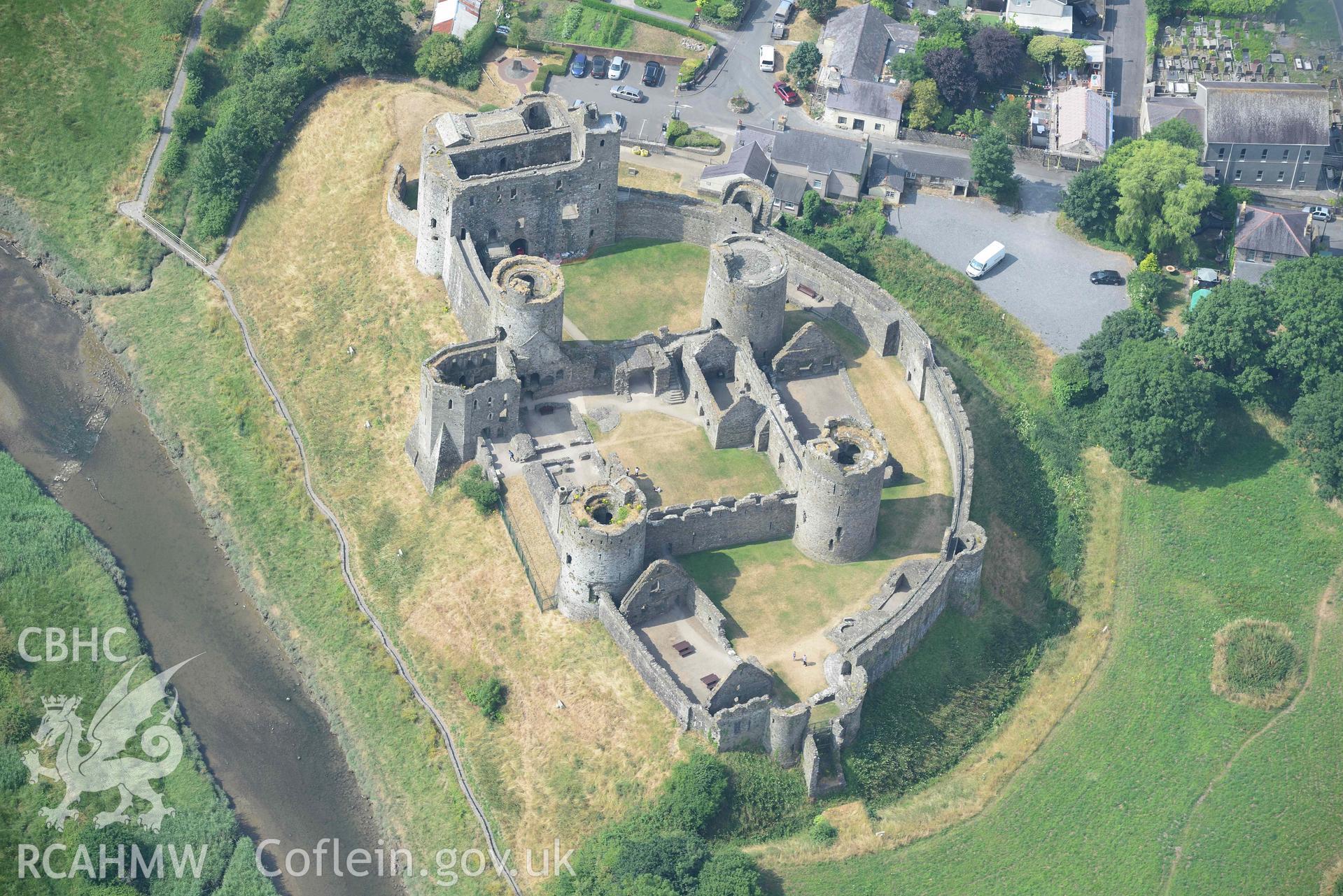 Aerial photography of Kidwelly Castle Aerial reconnaissance survey for the CHERISH Project. Crown Copyright: CHERISH PROJECT 2018. Produced with EU funds through the Ireland Wales Co-operation Programme 2014-2020. All material made freely available through the Open Government Licence.