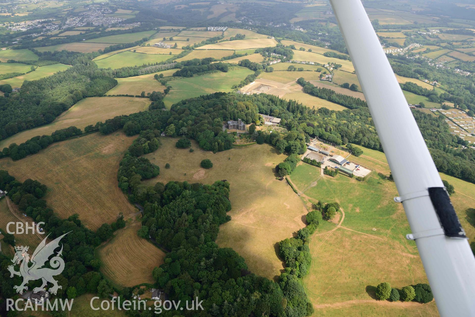 Aerial photography of  Hean Castle and garden Aerial reconnaissance survey for the CHERISH Project. Crown Copyright: CHERISH PROJECT 2018. Produced with EU funds through the Ireland Wales Co-operation Programme 2014-2020. All material made freely available through the Open Government Licence.