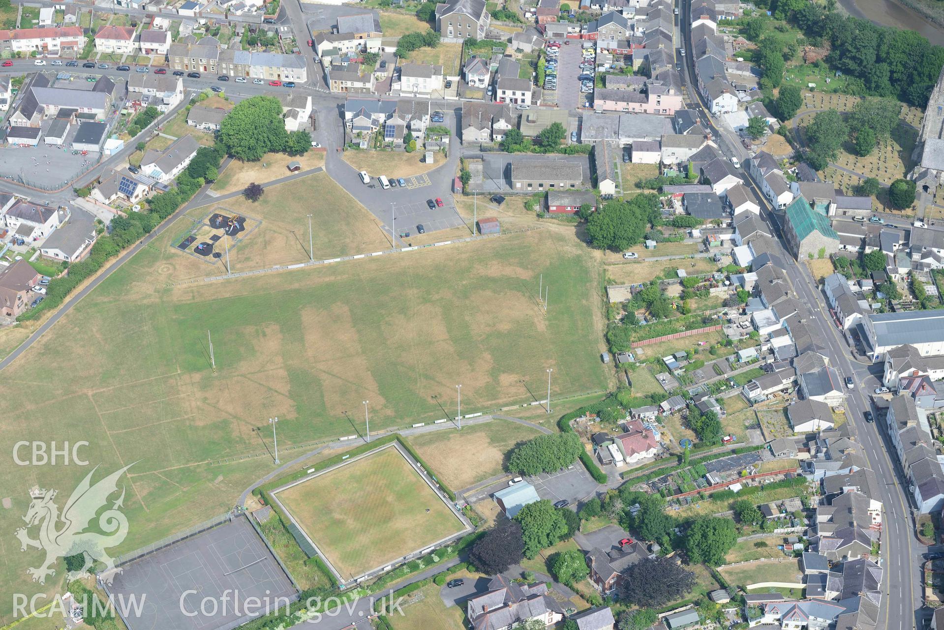 Aerial photography of Kidwell Town & borough with parchmarks in grassland Aerial reconnaissance survey for the CHERISH Project. Crown Copyright: CHERISH PROJECT 2018. Produced with EU funds through the Ireland Wales Co-operation Programme 2014-2020. All material made freely available through the Open Government Licence.