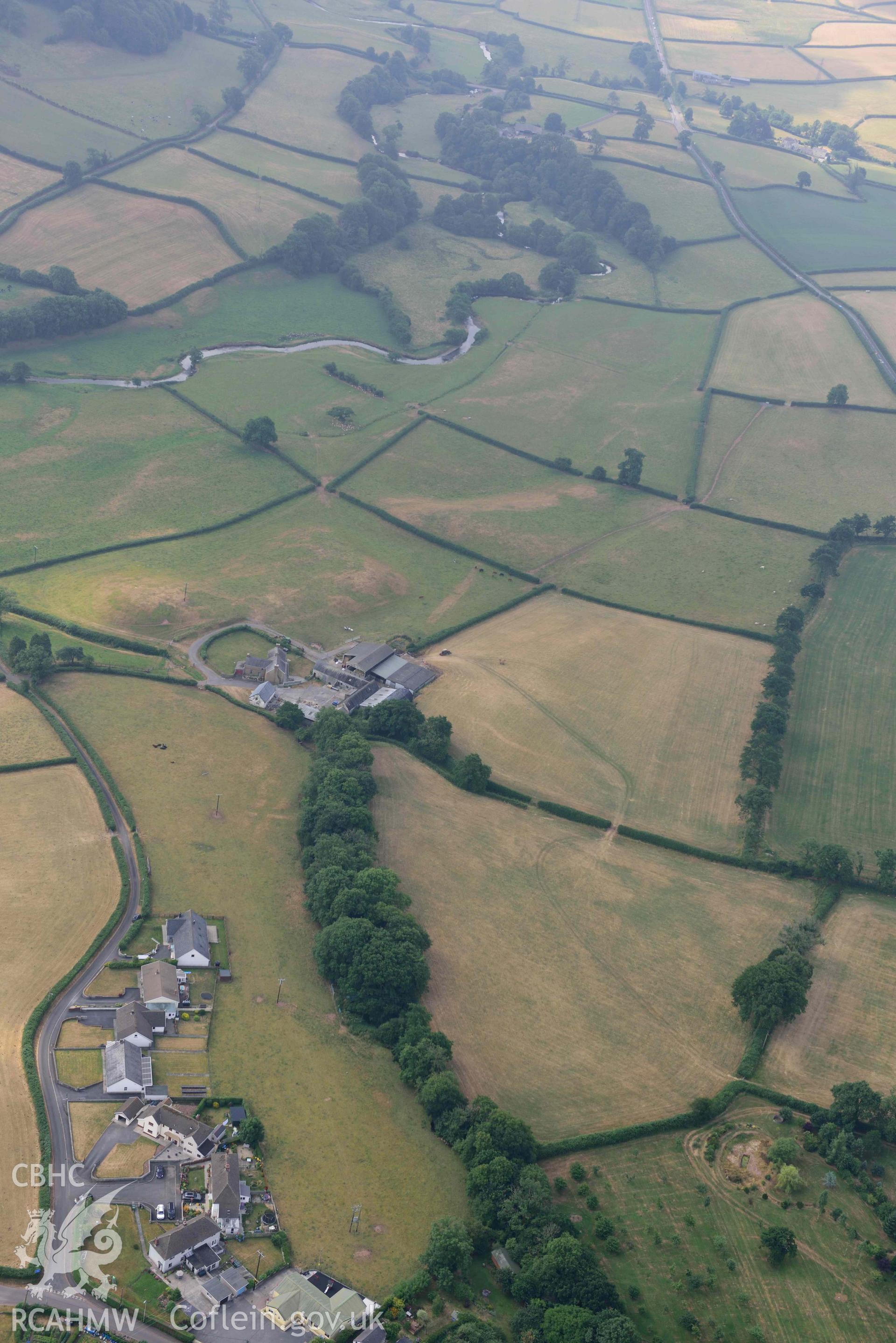 Aerial photography of Llandyfaelog village and Roman road, south of Nantllan Aerial reconnaissance survey for the CHERISH Project. Crown Copyright: CHERISH PROJECT 2018. Produced with EU funds through the Ireland Wales Co-operation Programme 2014-2020. All material made freely available through the Open Government Licence.