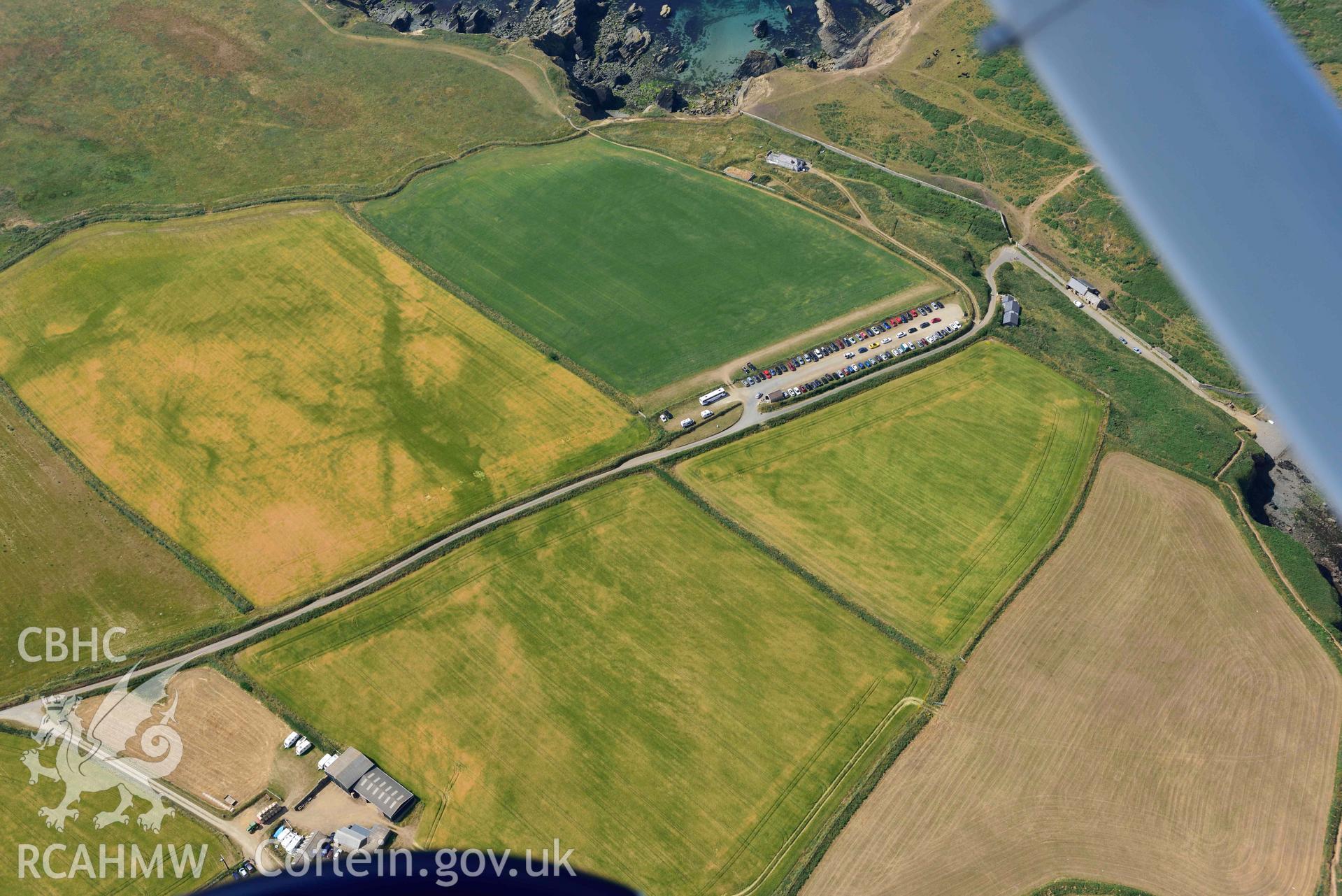 Aerial photography of Non, arch cropmarks between West Hook and Martins Haven Aerial reconnaissance survey for the CHERISH Project. Crown Copyright: CHERISH PROJECT 2018. Produced with EU funds through the Ireland Wales Co-operation Programme 2014-2020. All material made freely available through the Open Government Licence.