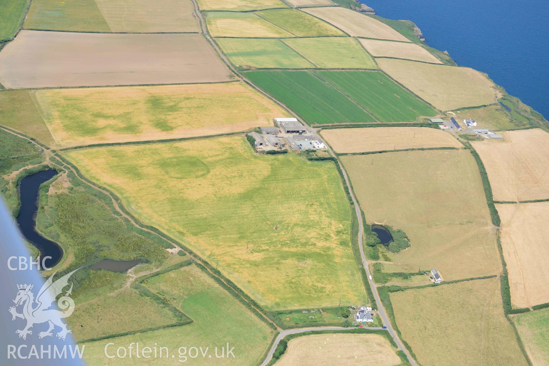 Aerial photography of Trehill Farm defended enclosure, Marloes Aerial reconnaissance survey for the CHERISH Project. Crown Copyright: CHERISH PROJECT 2018. Produced with EU funds through the Ireland Wales Co-operation Programme 2014-2020. All material made freely available through the Open Government Licence.