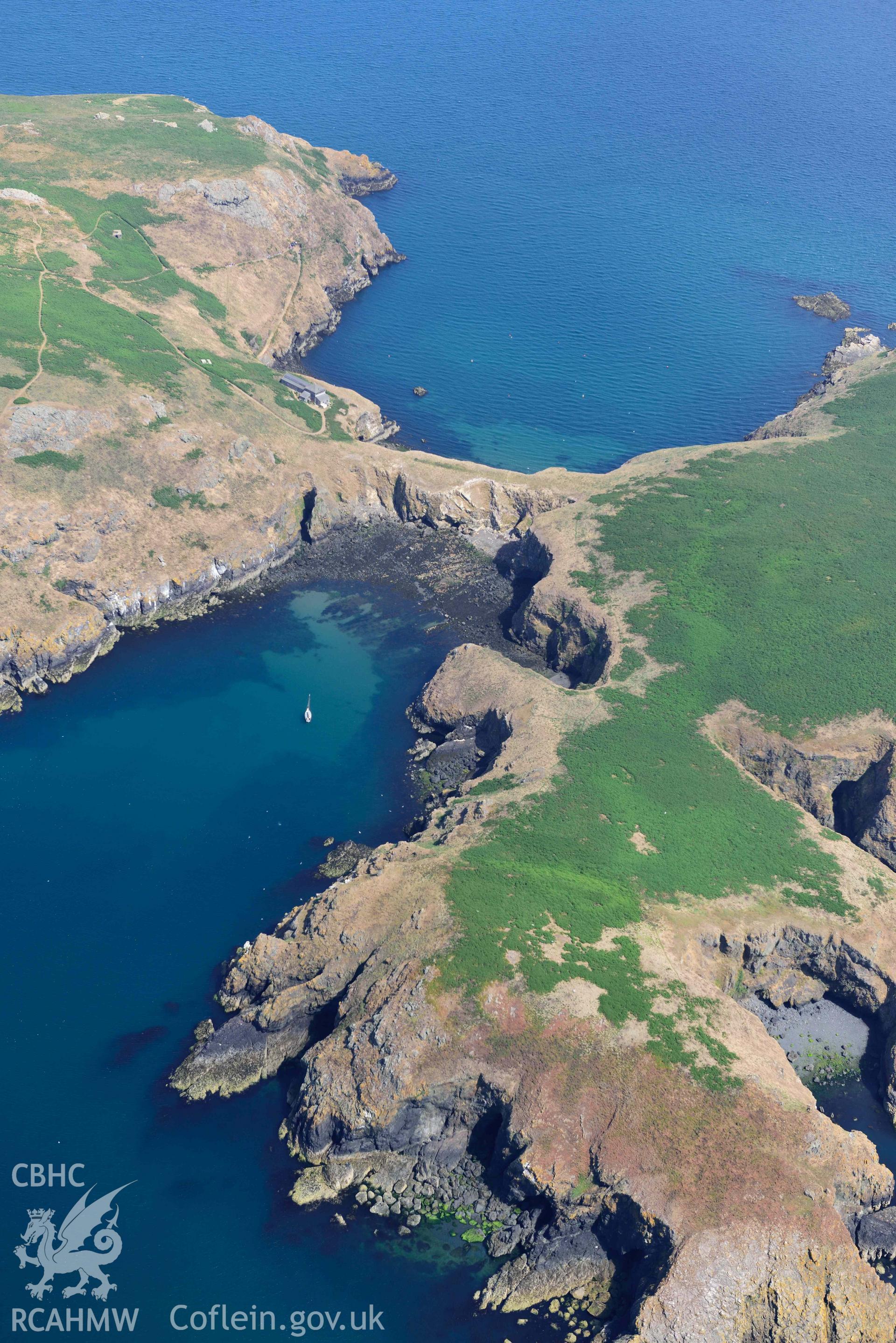 Aerial photography of Skomer Island: Warden's House and Neck Isthmus Aerial reconnaissance survey for the CHERISH Project. Crown Copyright: CHERISH PROJECT 2018. Produced with EU funds through the Ireland Wales Co-operation Programme 2014-2020. All material made freely available through the Open Government Licence.