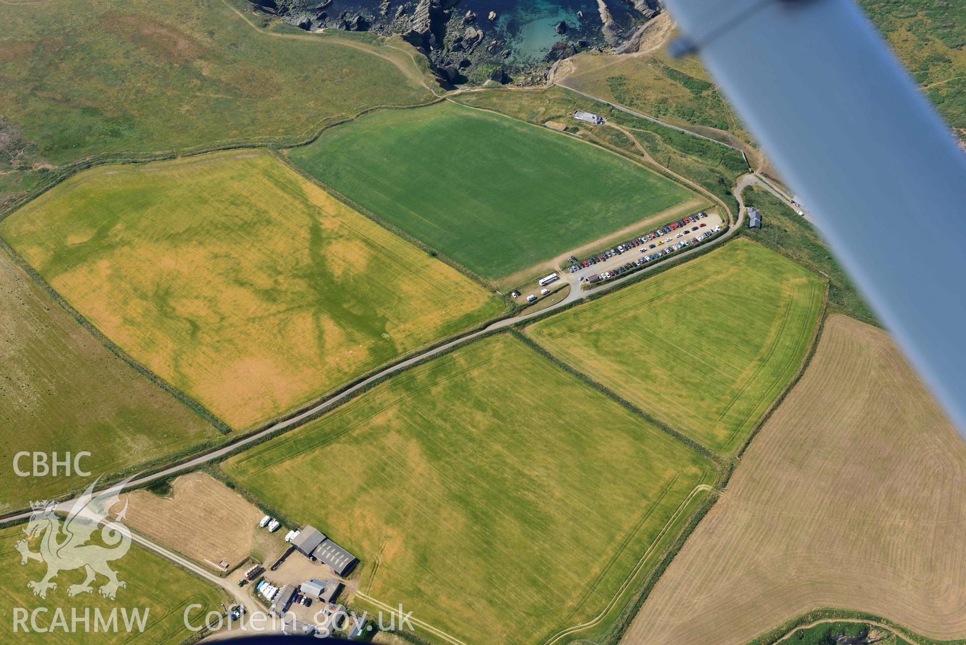 Aerial photography of Non, arch cropmarks between West Hook and Martins Haven Aerial reconnaissance survey for the CHERISH Project. Crown Copyright: CHERISH PROJECT 2018. Produced with EU funds through the Ireland Wales Co-operation Programme 2014-2020. All material made freely available through the Open Government Licence.